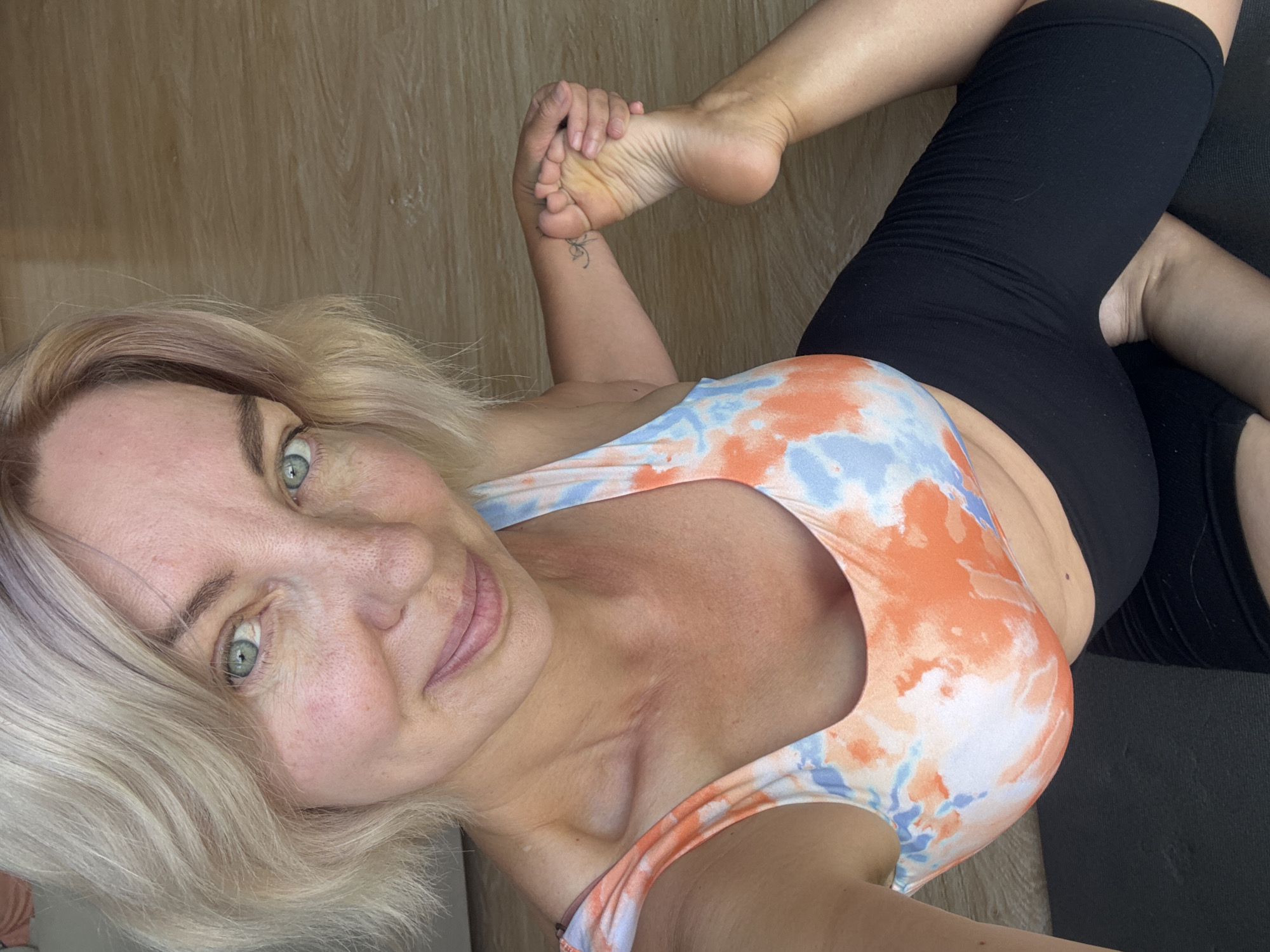 Yoga session on a black mat in Sochi, Russia