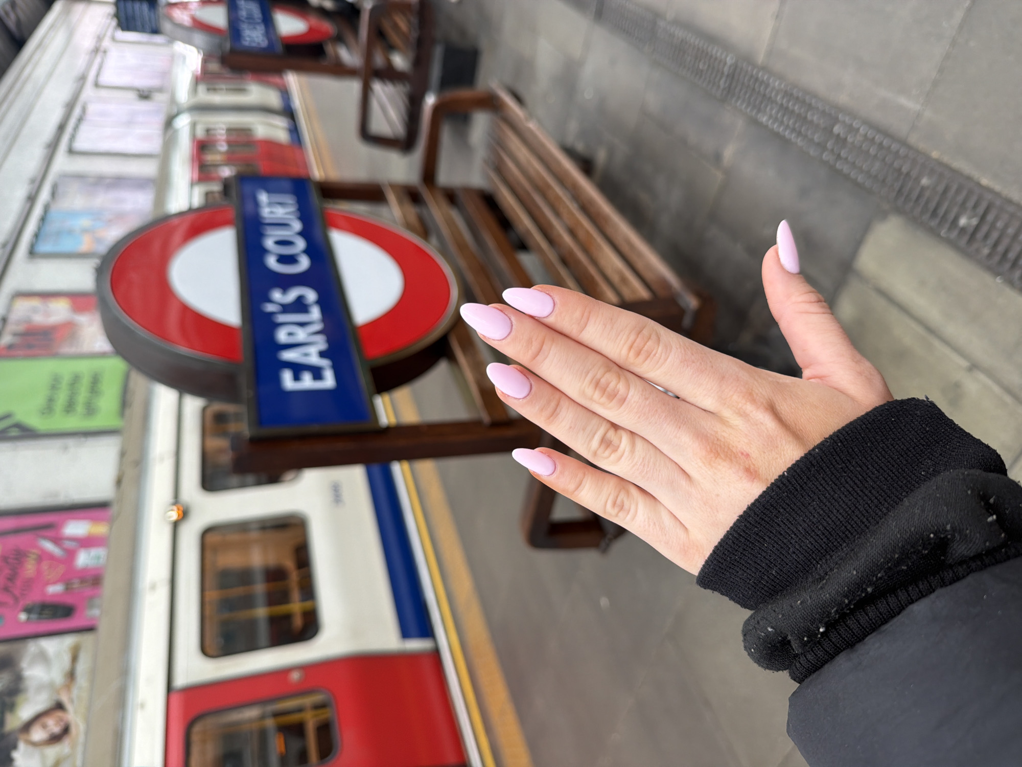 Woman photographed at Earl's Court Underground station in London