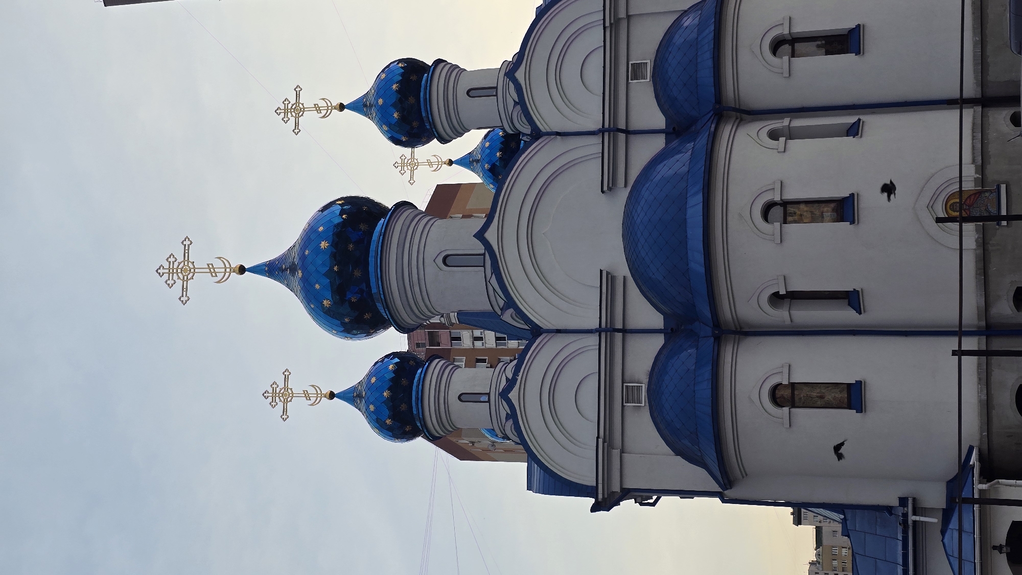 Orthodox church and urban lakeside scenes in a post-Soviet city