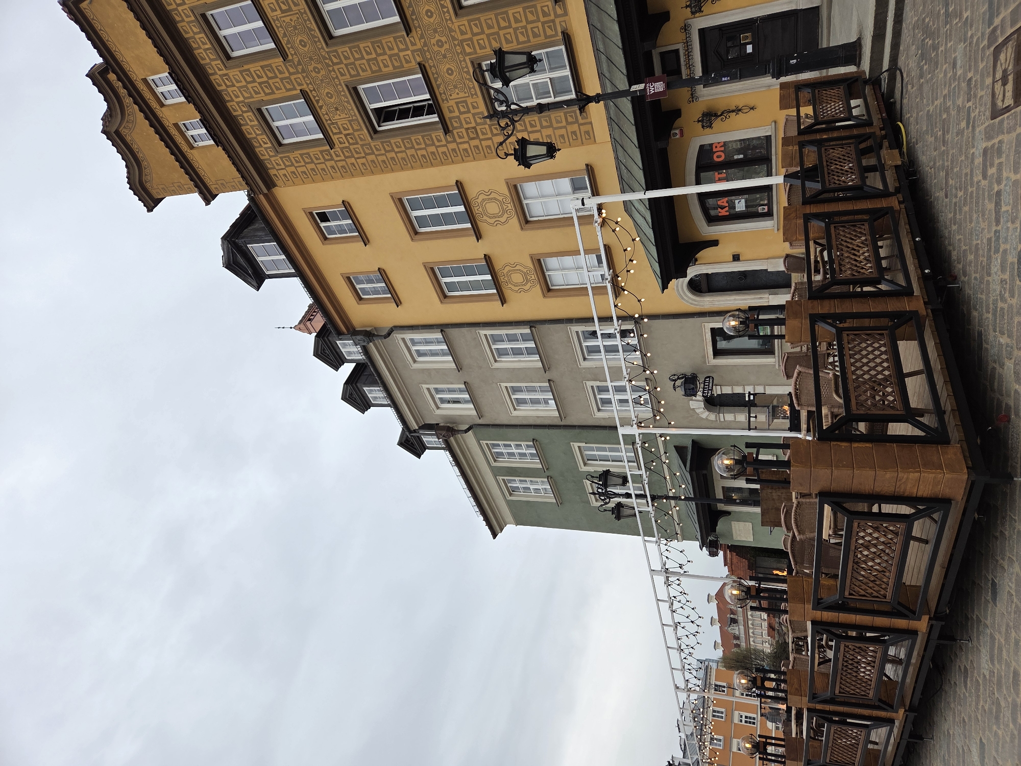 Film crew interviews woman in Warsaw's Old Town