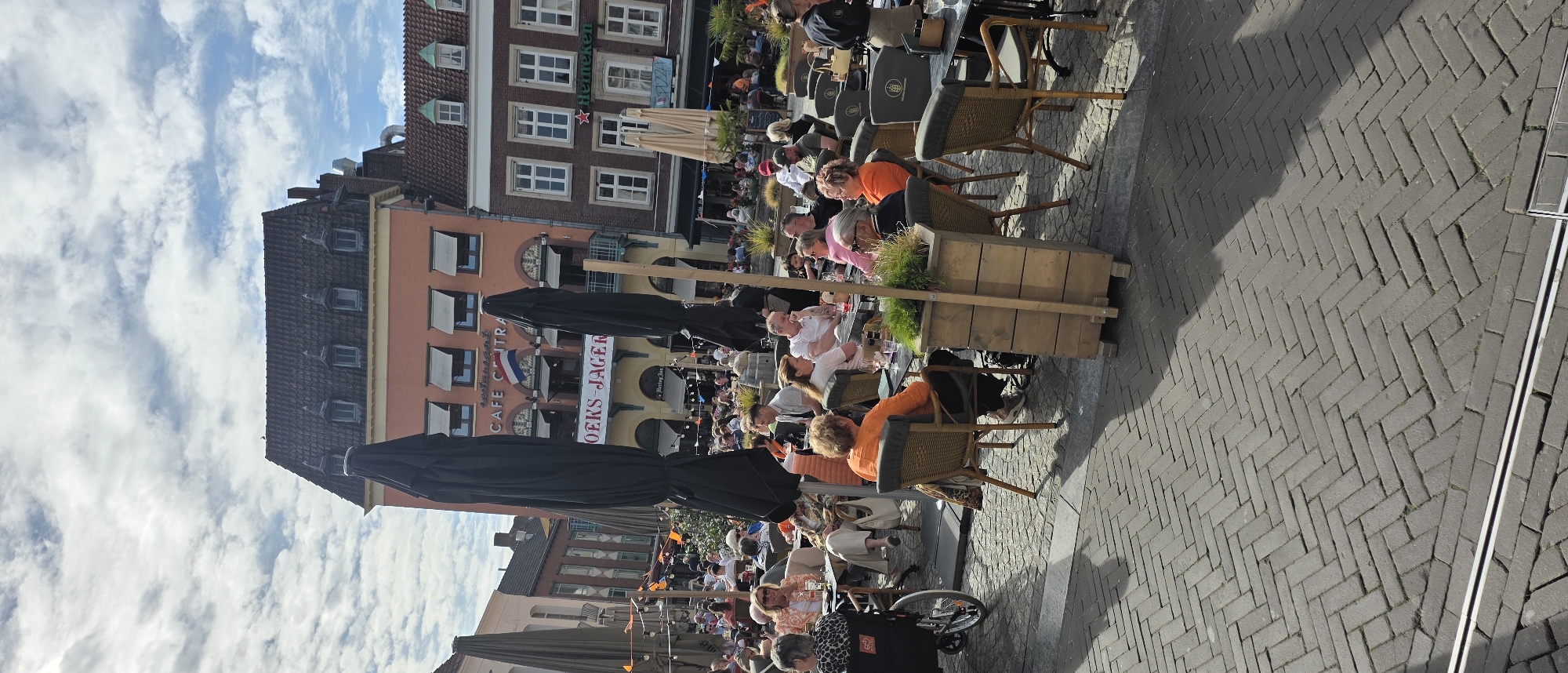 Busy outdoor cafe terrace observed in Venlo, Netherlands
