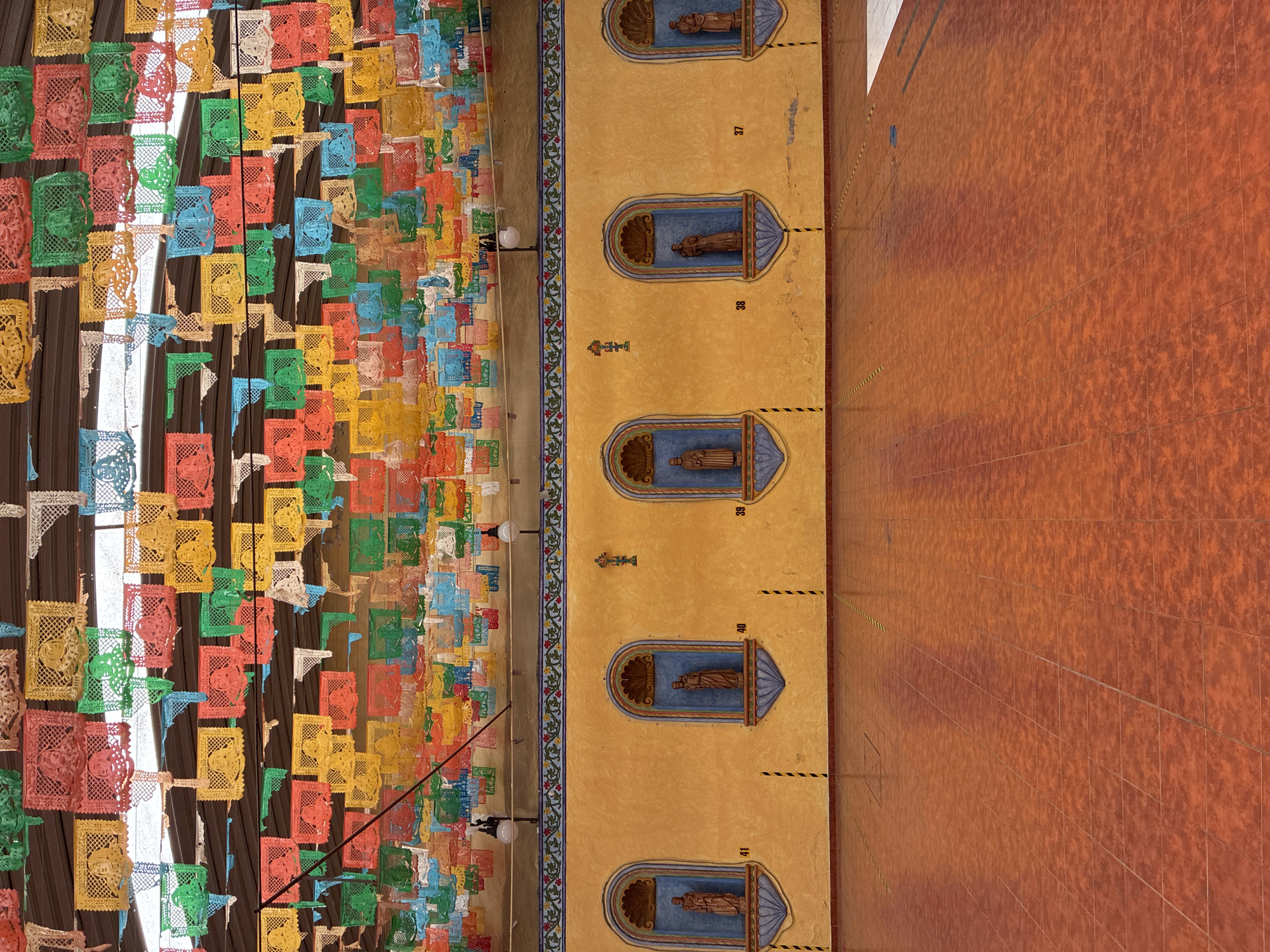 Traditional papel picado decorations spotted on Puebla building facade