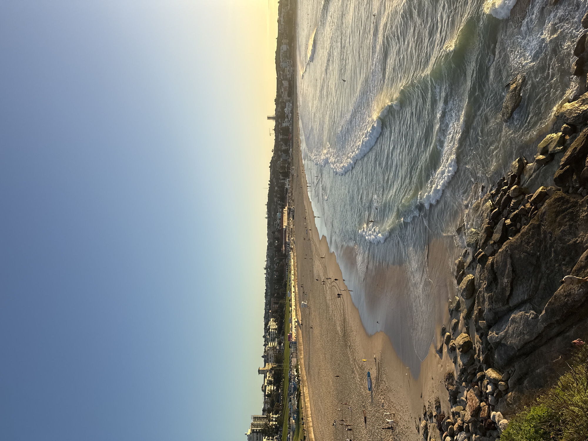 Golden hour scenes captured at busy Bondi Beach