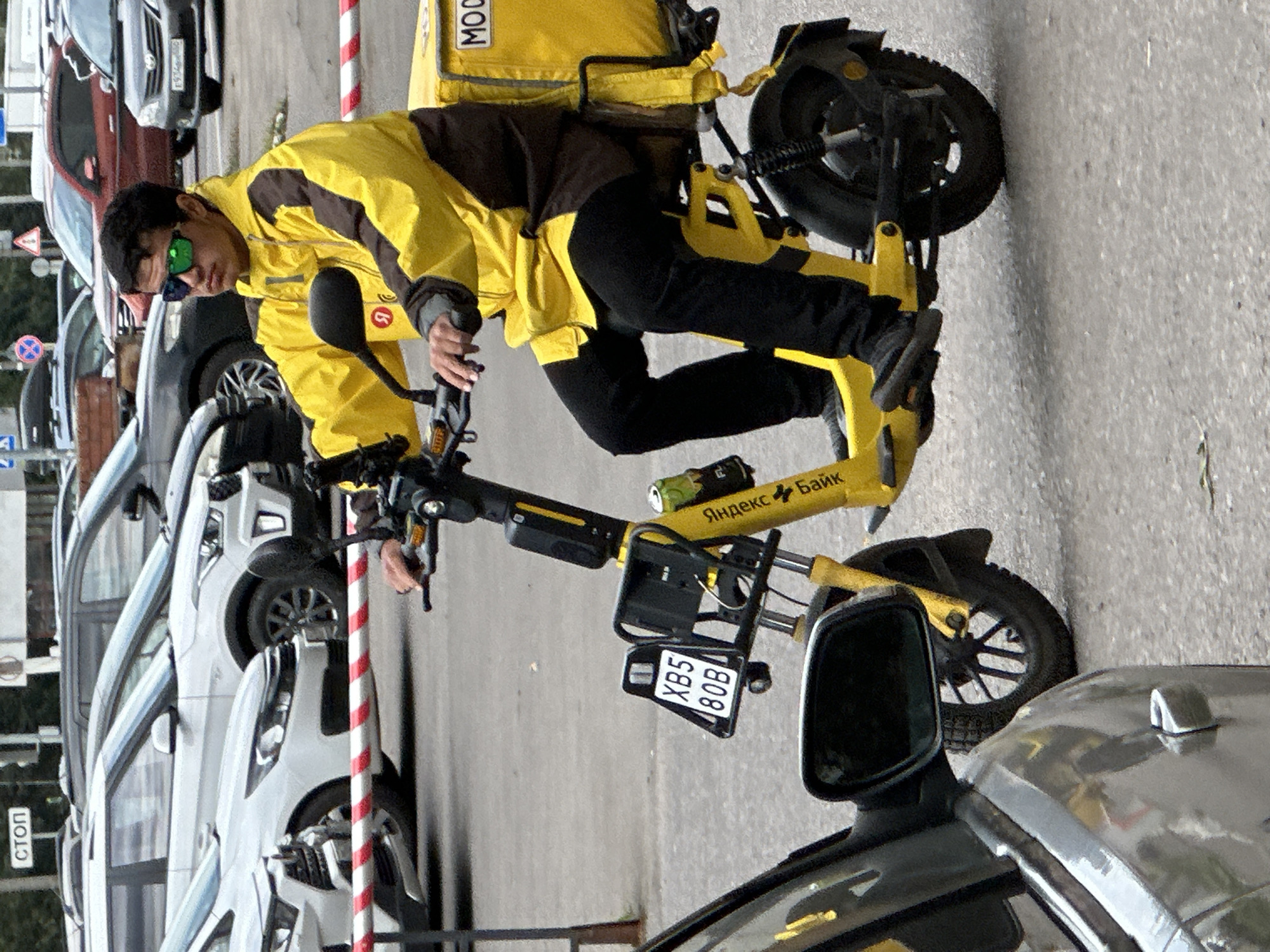 Yellow taxis, a cargo scooter, and police in Podolsk