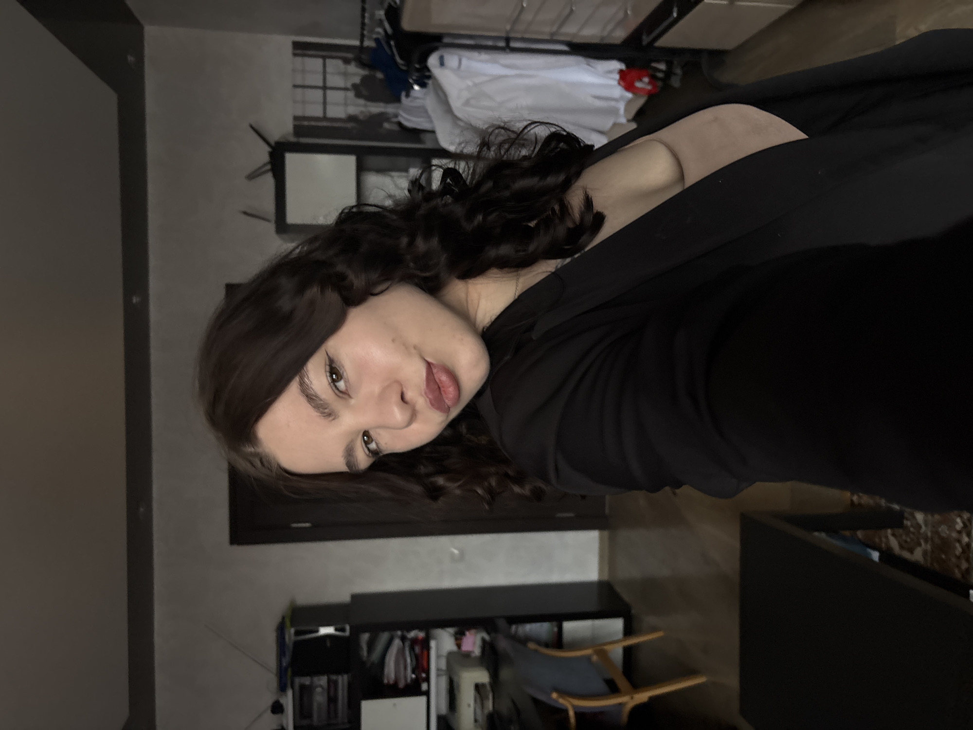 Woman takes selfies indoors in Perm residential space