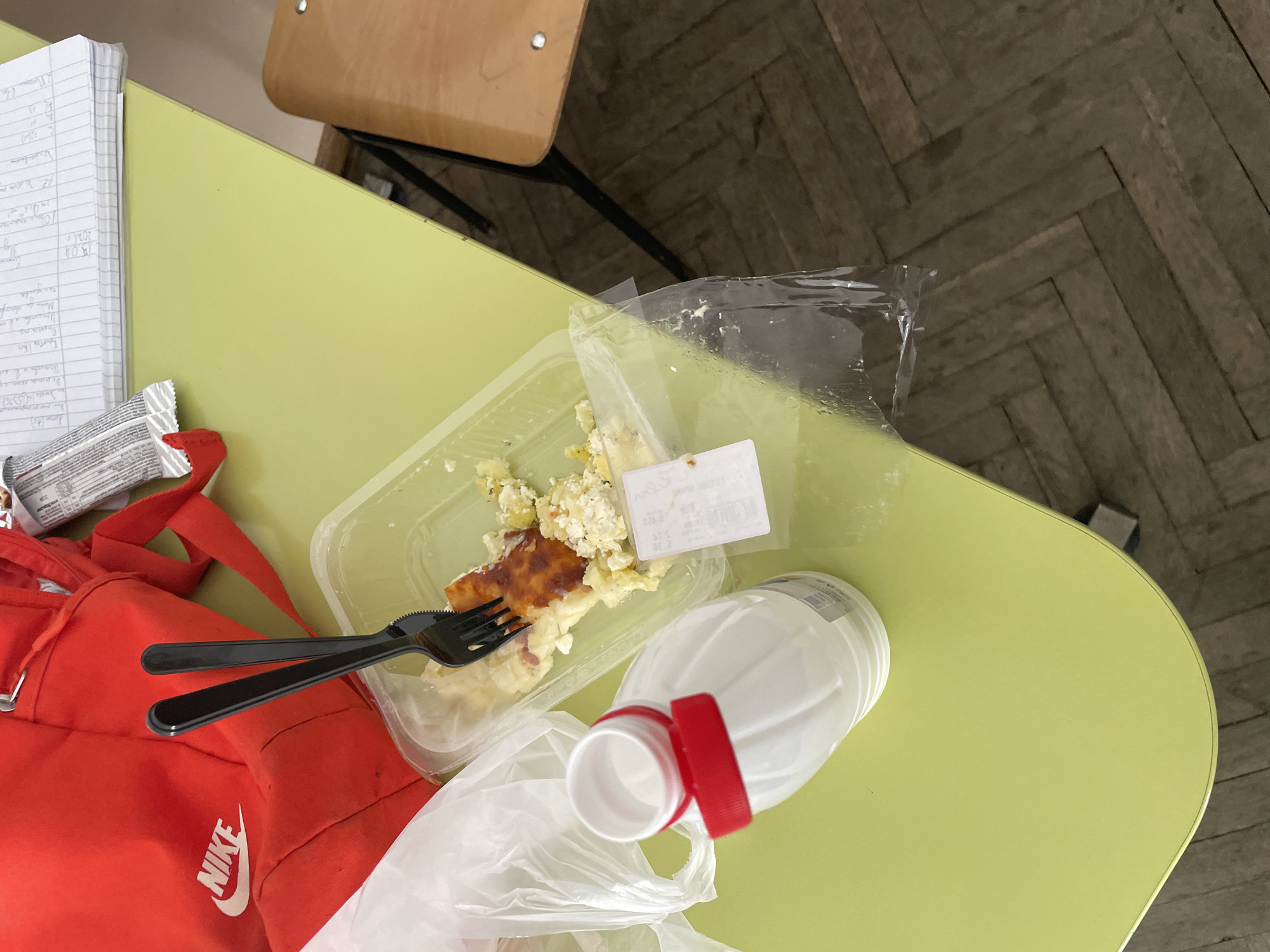 Student documents lunch break with fried chicken in Bulgarian classroom