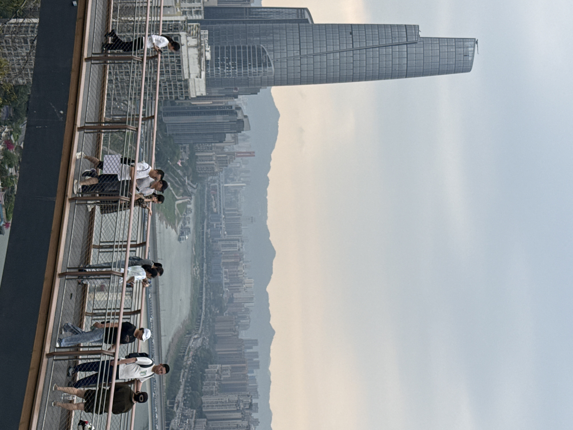 Tourists visit Chongqing observation decks and famous monorail station