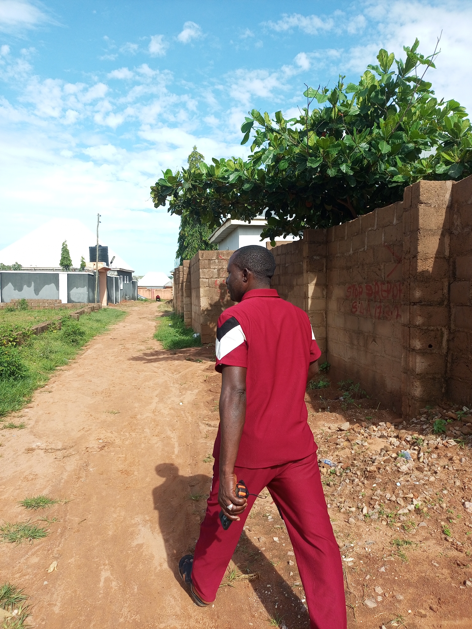 Morning activity around a family compound in Tempure, Nigeria