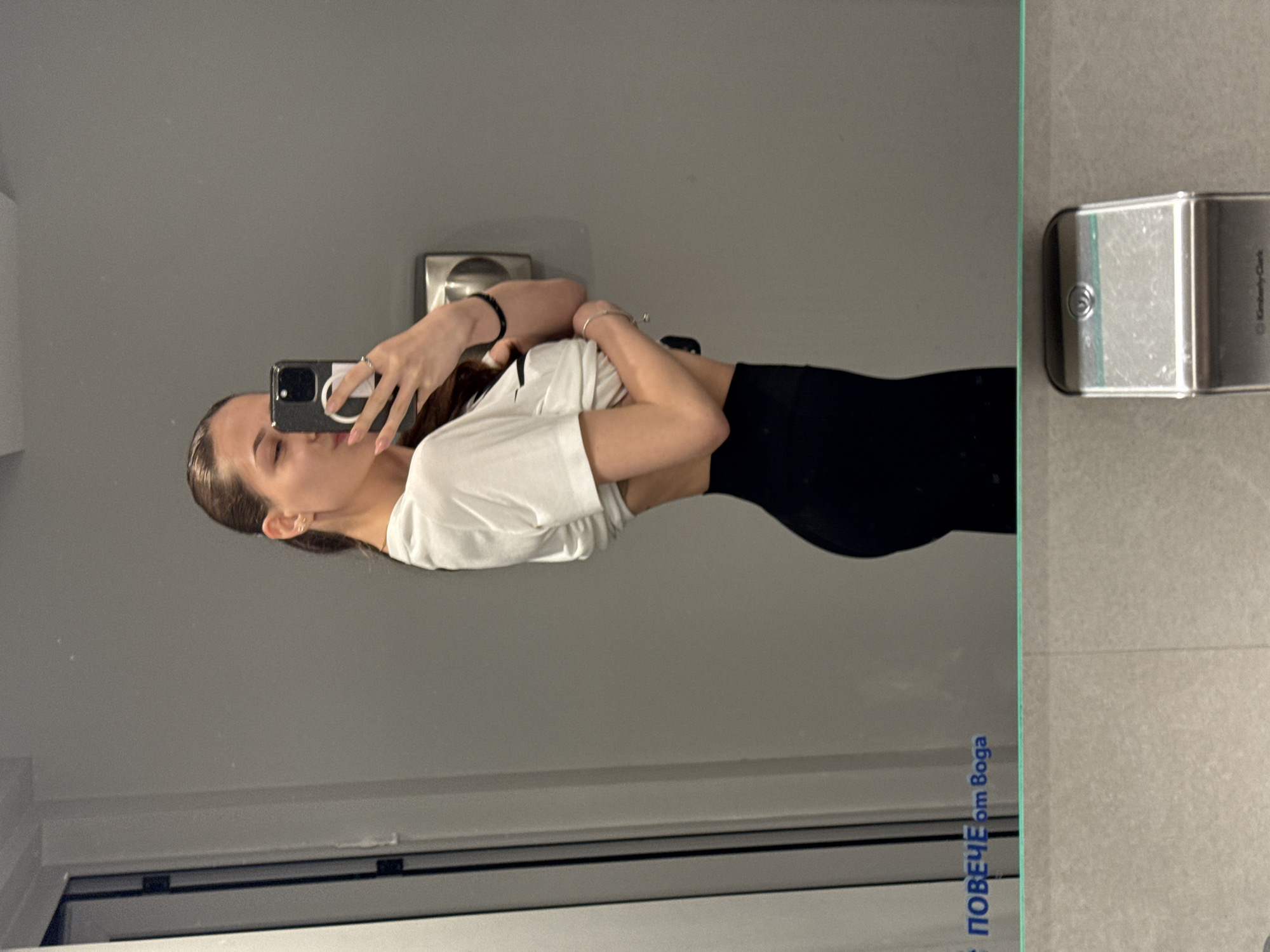 Woman takes mirror selfies in Sofia locker room facility