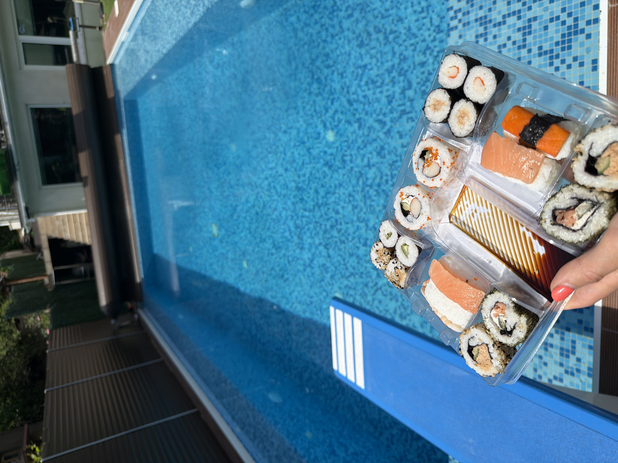 Sushi lunch enjoyed poolside in Sofia residential backyard