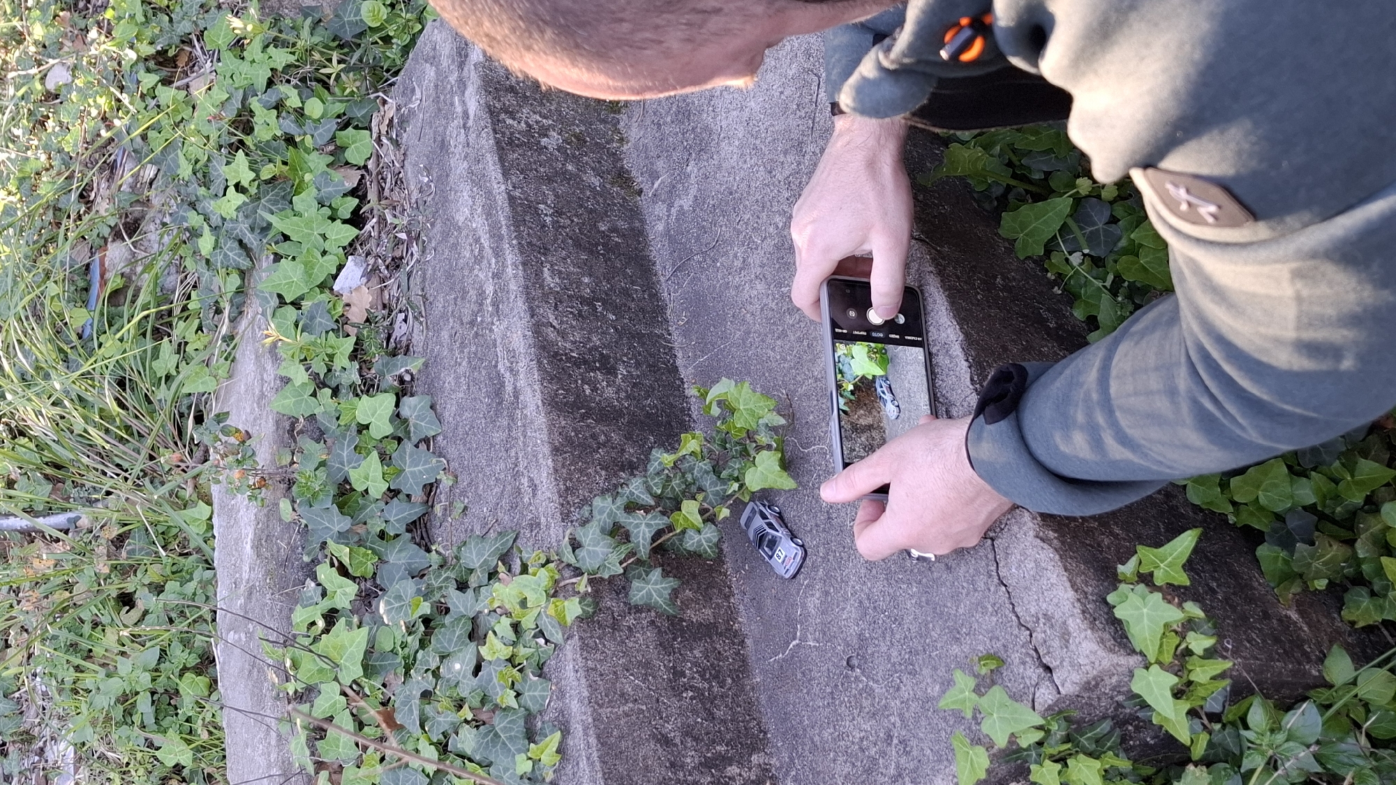 Toy car photography session among ivy-covered surfaces Montenegro