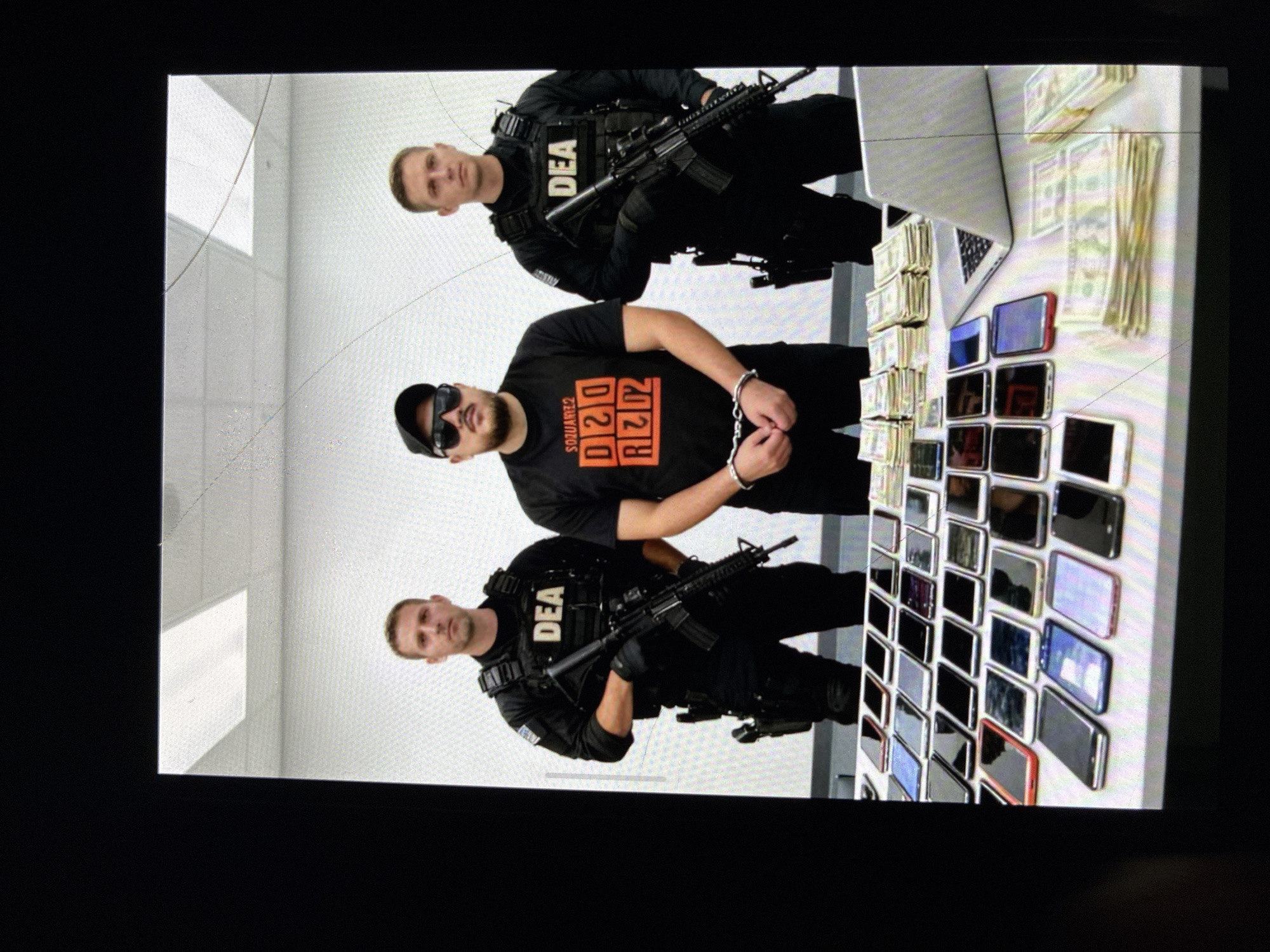 DEA officers with handcuffed individual observed in Kalitinovo, Bulgaria