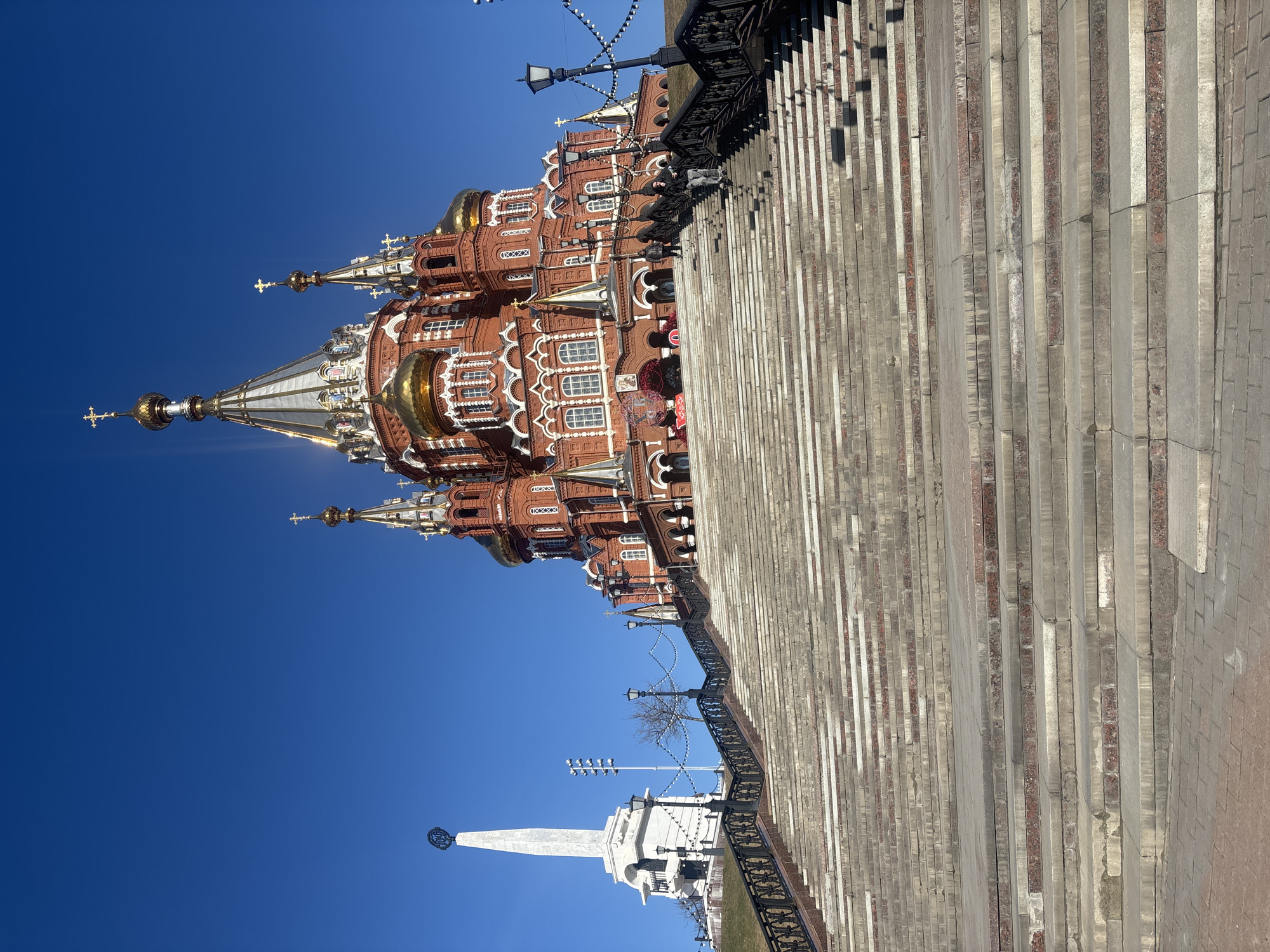 Grand red-brick architecture documented under clear skies in Izhevsk