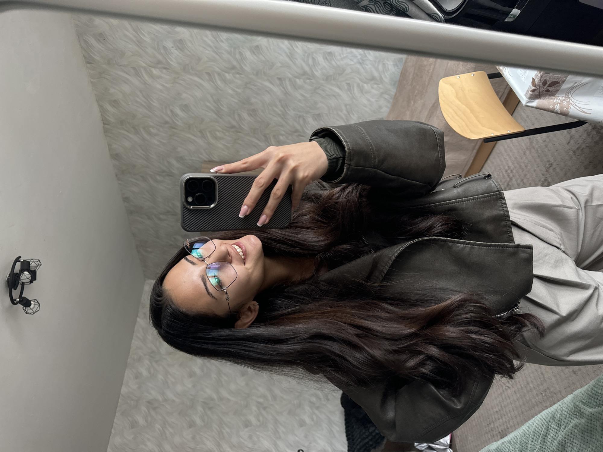 Woman takes mirror selfie at home in Sofia