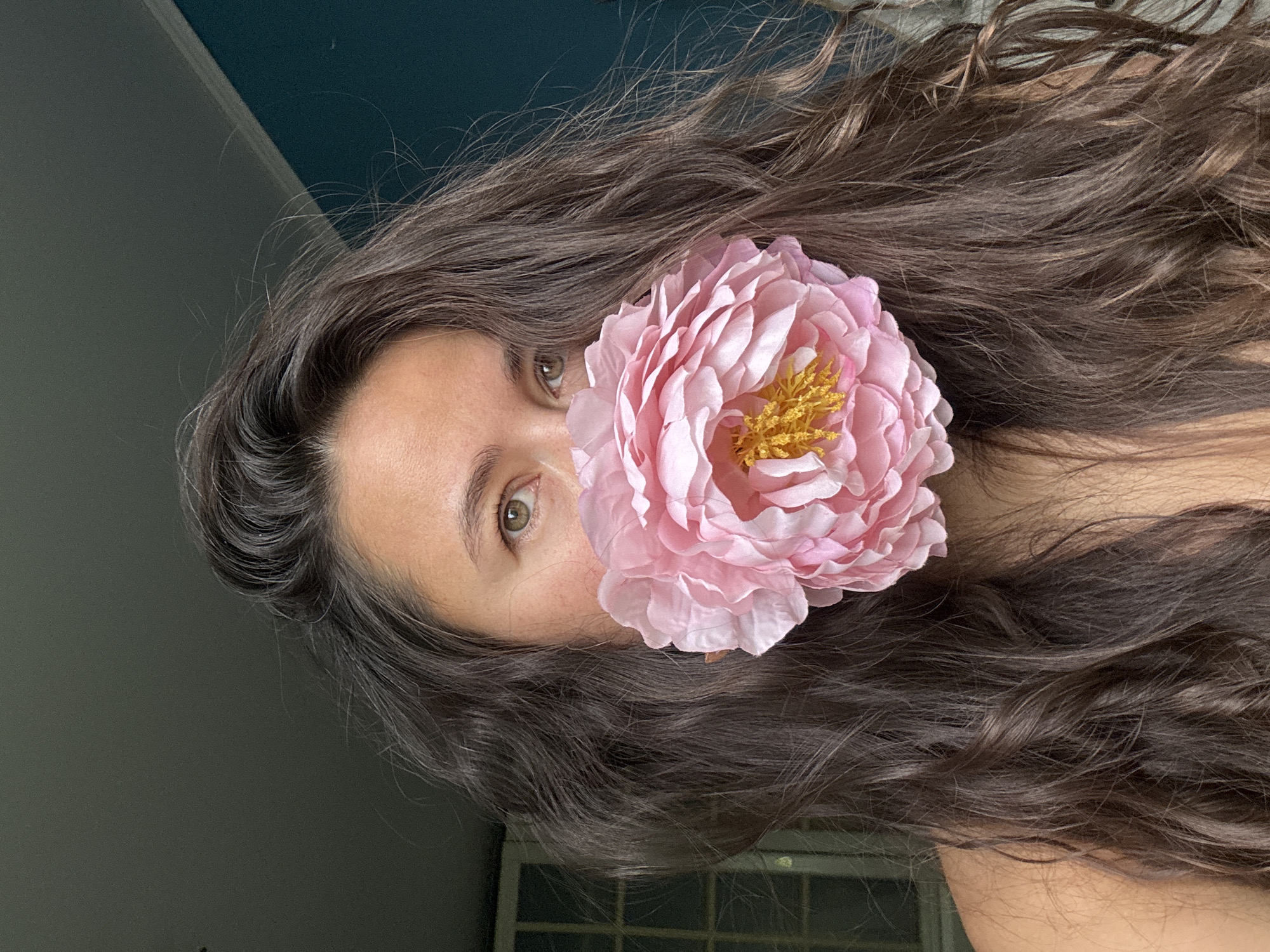 Portrait with pink flower documented in Kazan, Russia