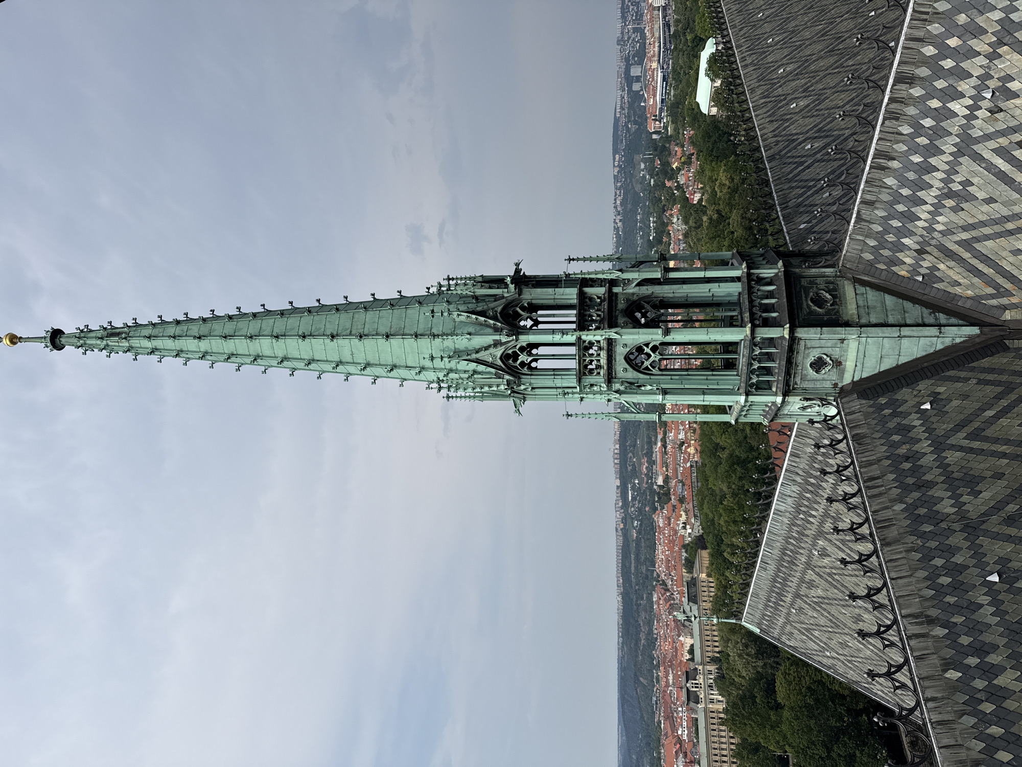 Gothic spire and rooftops rise above Prague