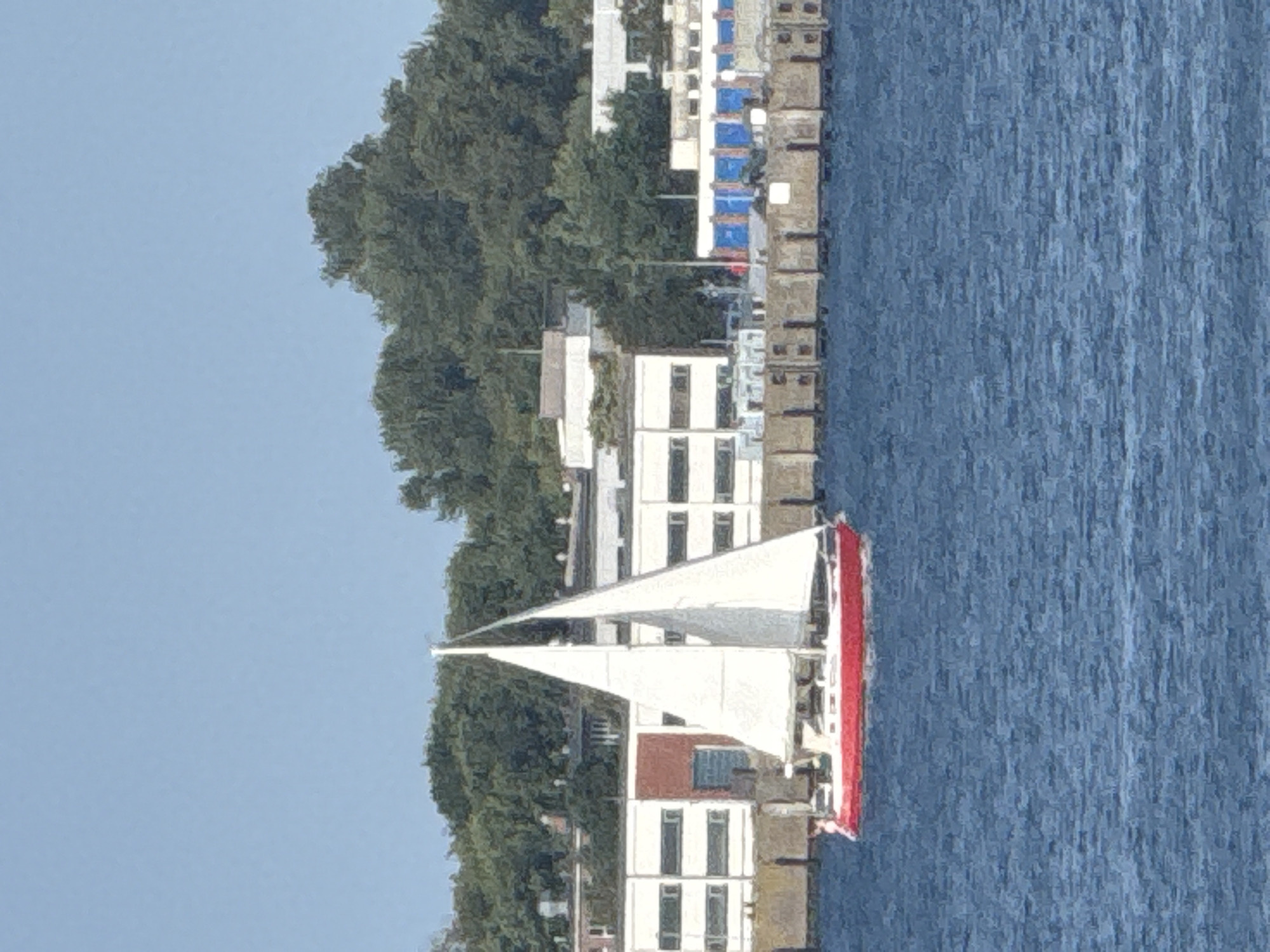 Sailboats, warships, and seagulls along Eckernförde's waterfront