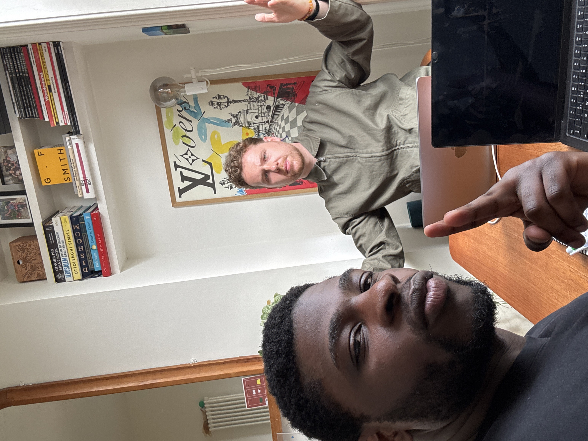 Two men captured in London indoor setting with office furniture