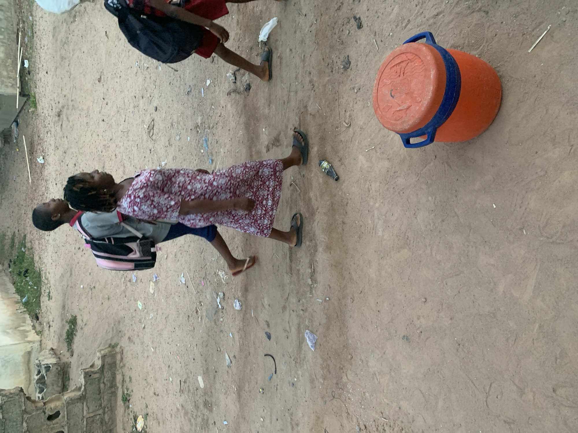 Daily life unfolds on Lokoja's dirt streets