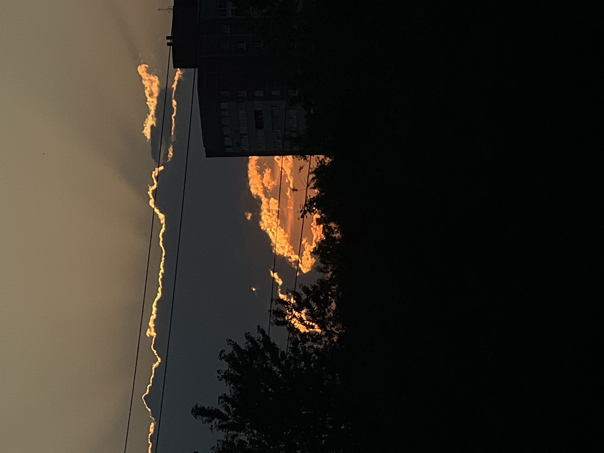 Saint Petersburg sunset through pylons, rooftops, and fading light