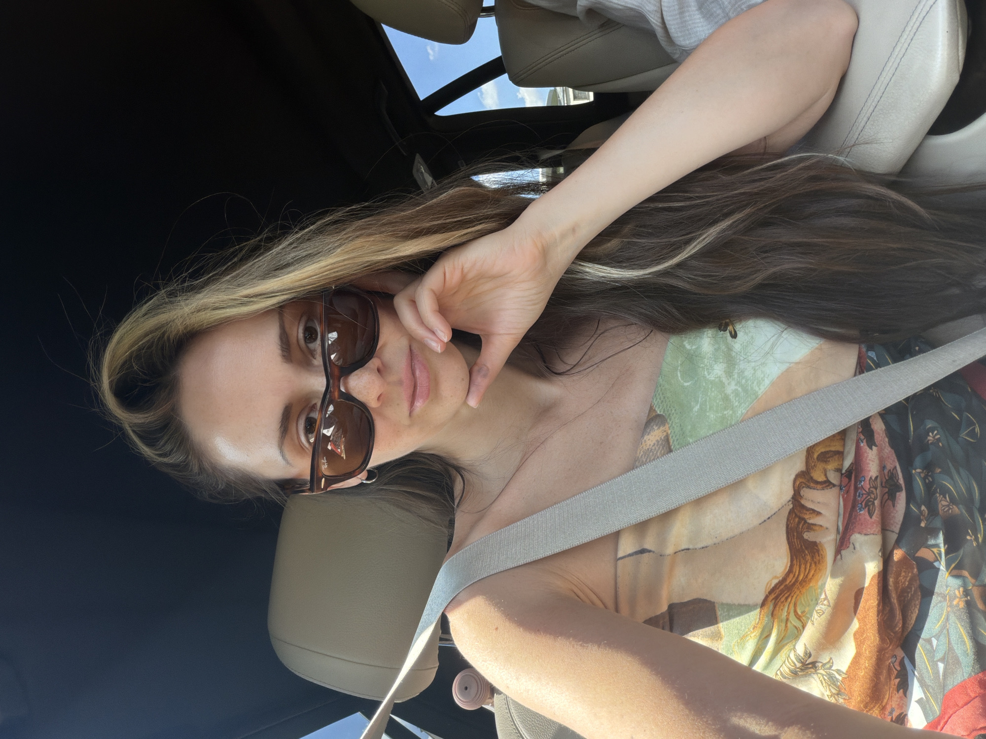 Woman poses in driver's seat in Moscow