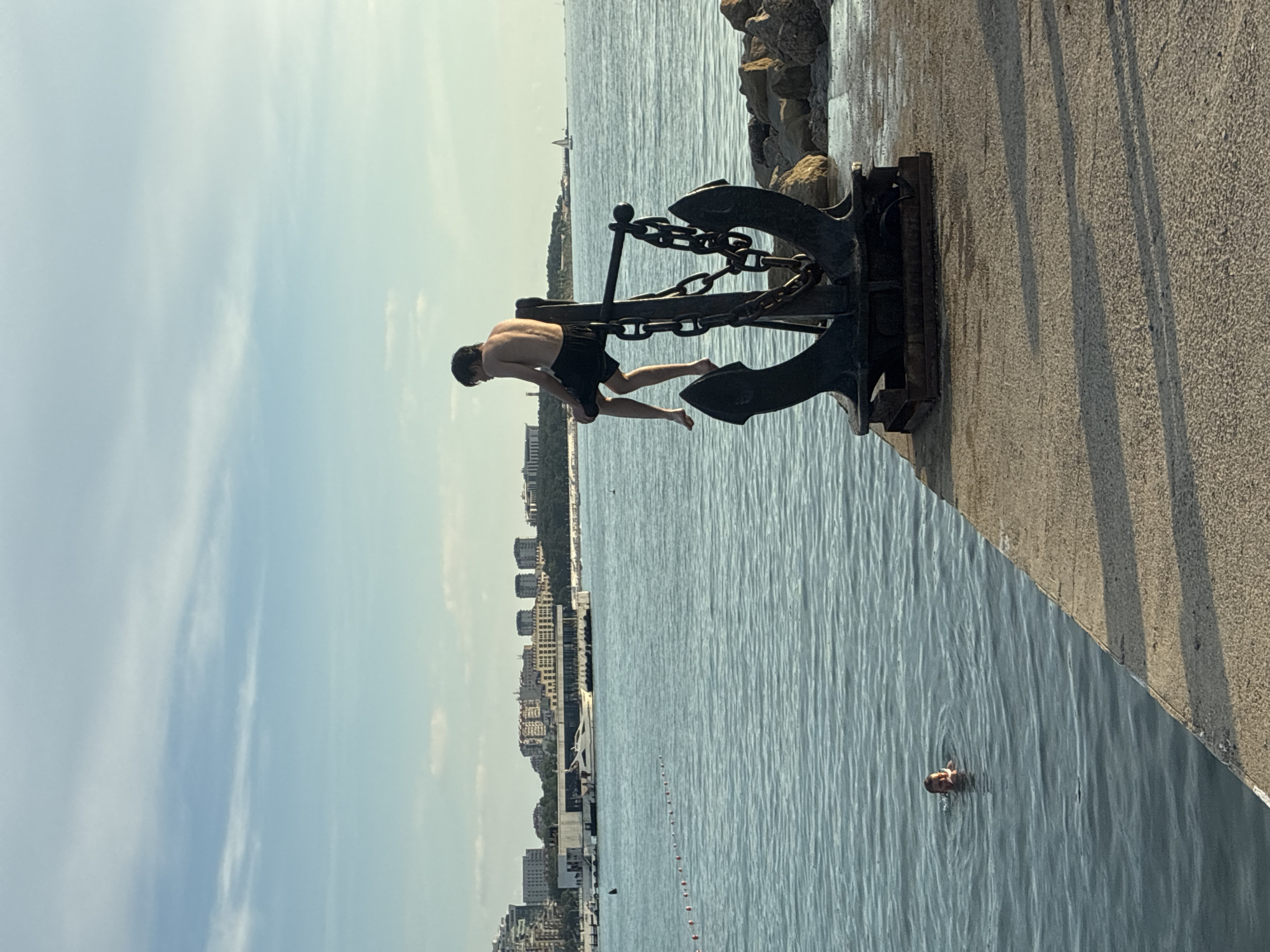 Evening promenade life in Gelendzhik with street performers and beachgoers