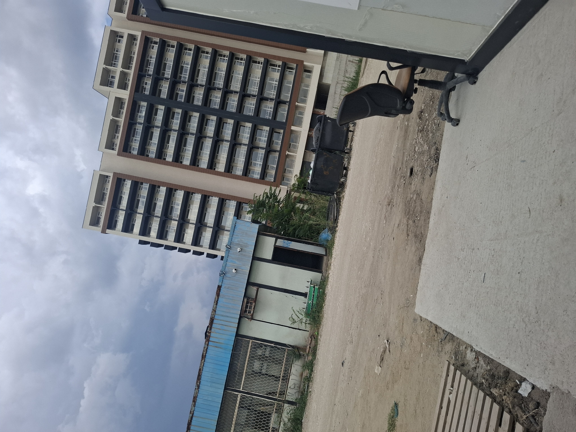 Plovdiv neighborhood mid-build: cranes, apartments, and street life