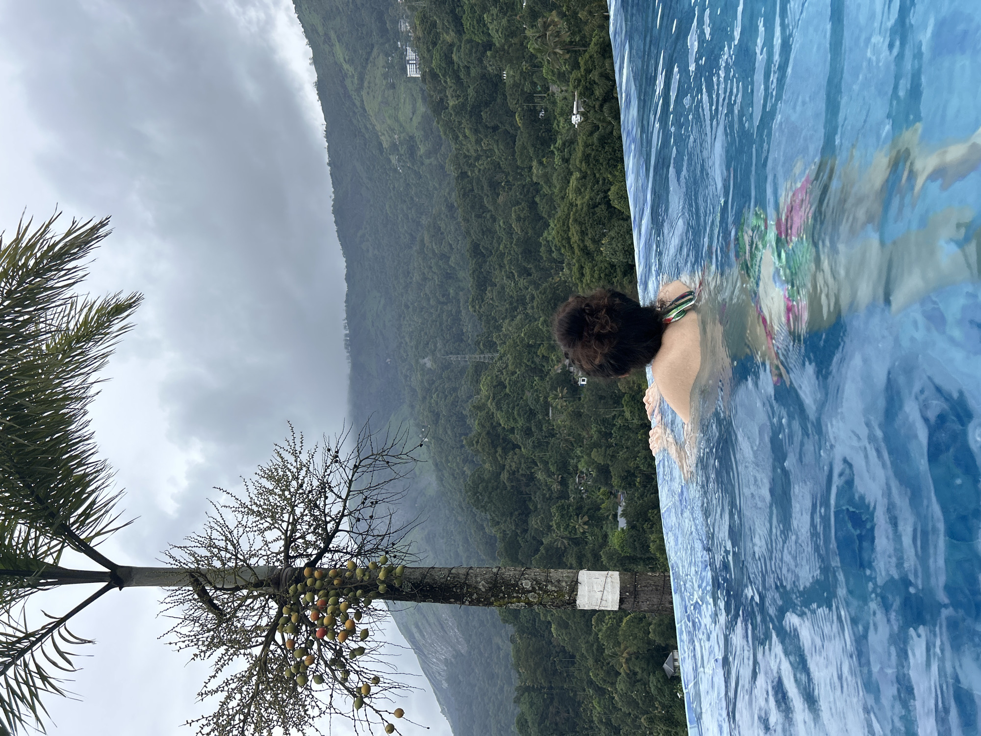 Rainy morning pool session in Anachal's mountain resort