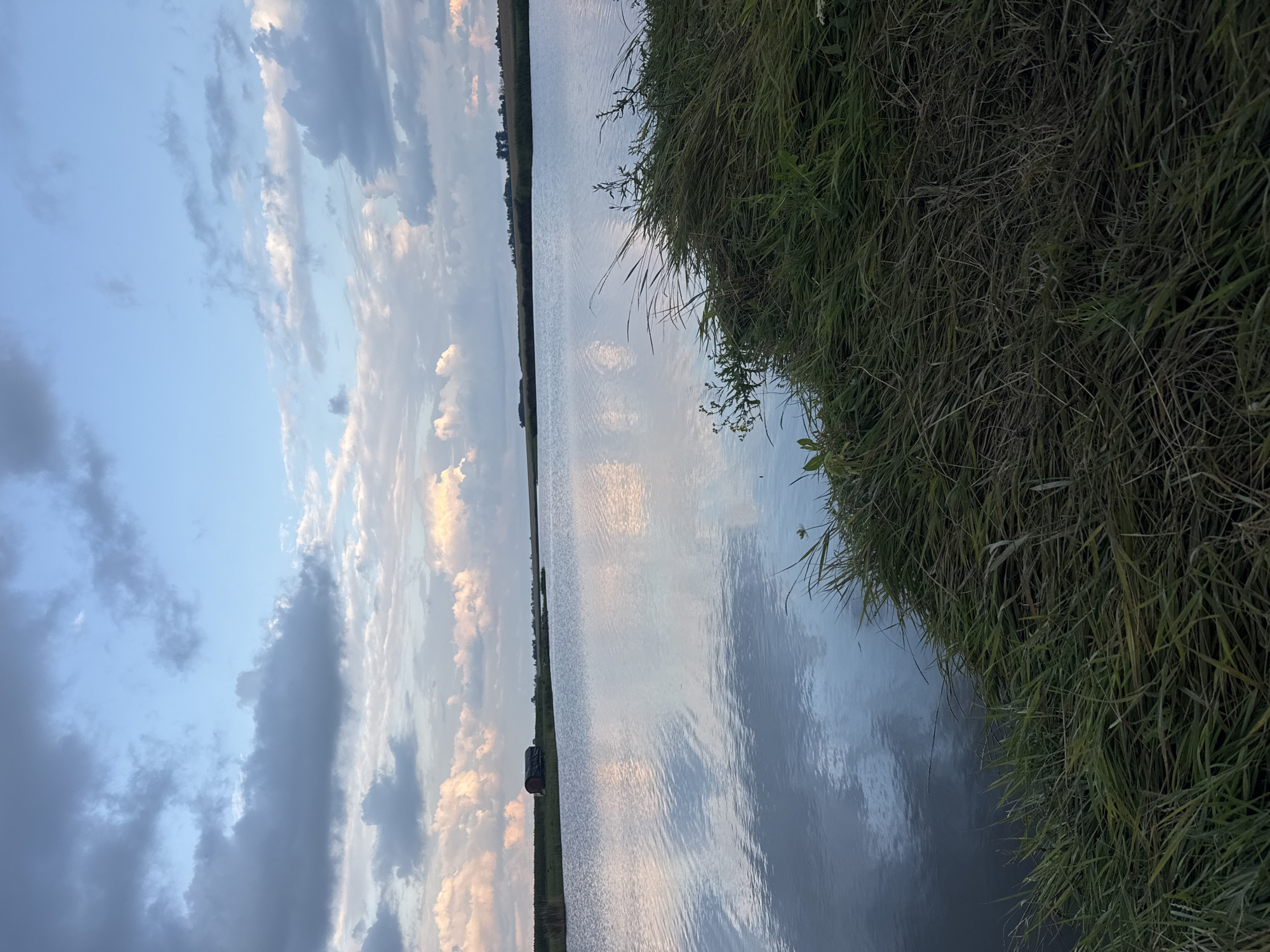 Lakeside fishing session under gathering storm clouds in Tarasivka