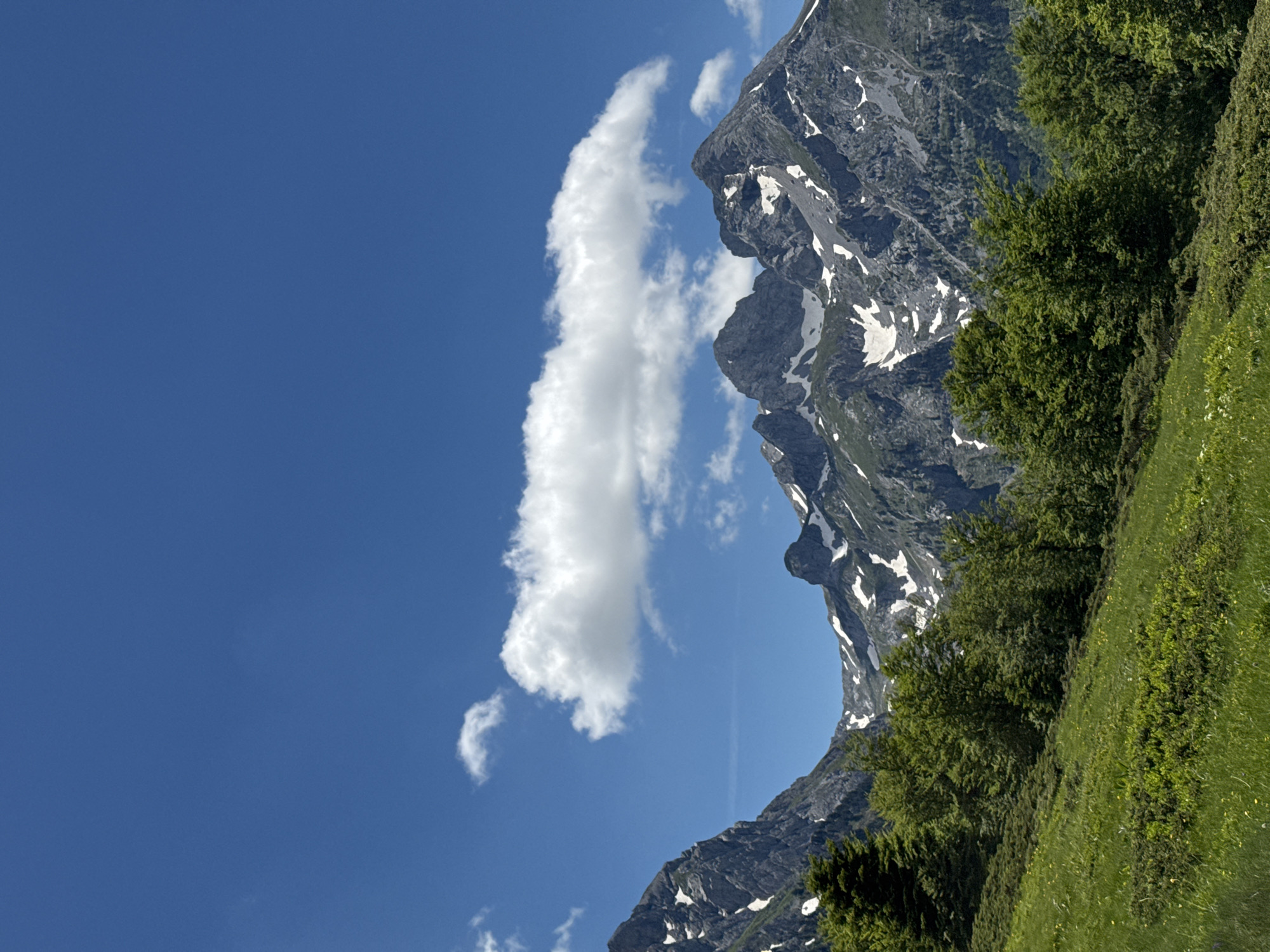 Mountain landscape with dirt road observed under clear skies
