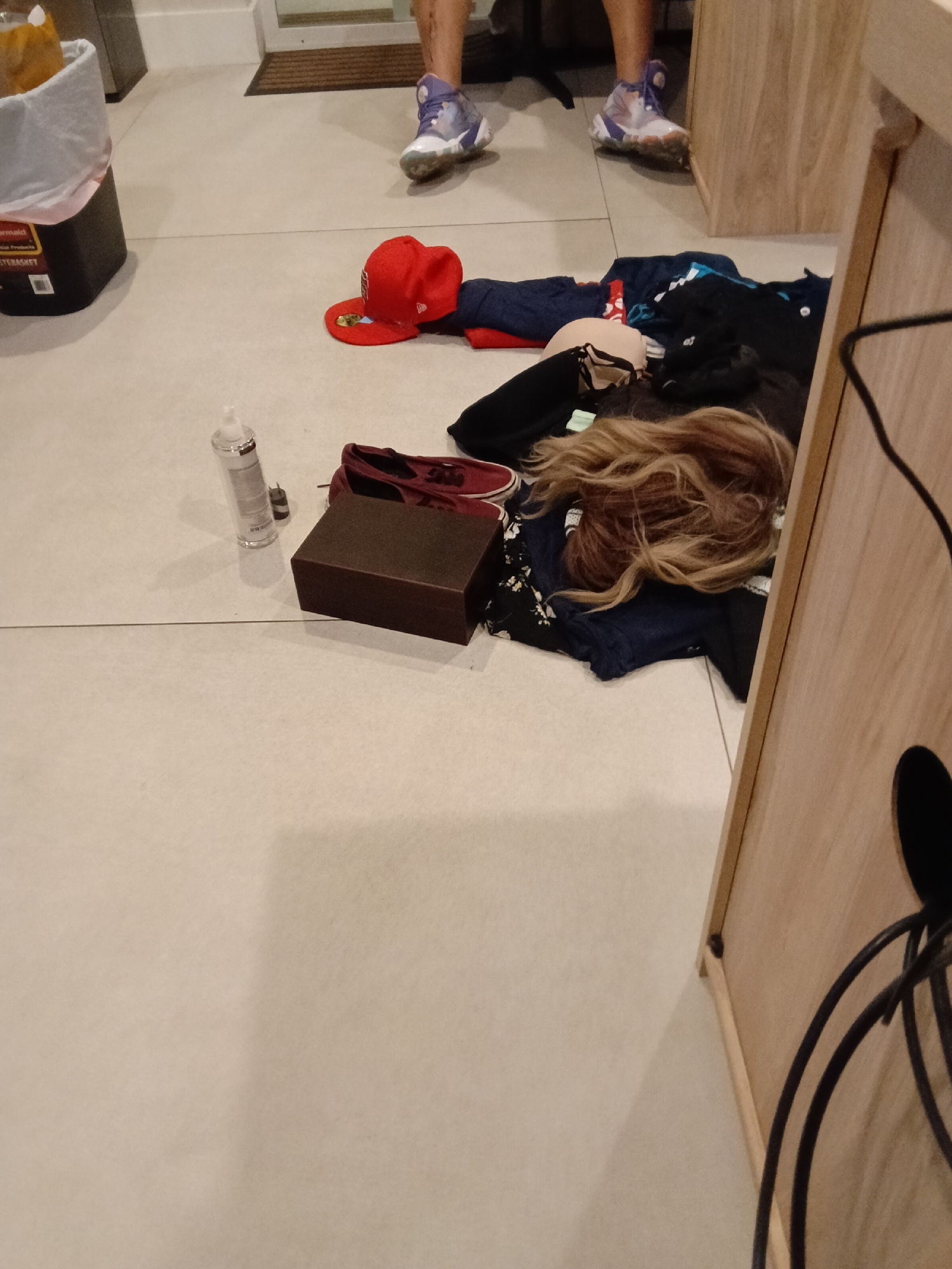 Cluttered indoor floor scene captured in Los Angeles