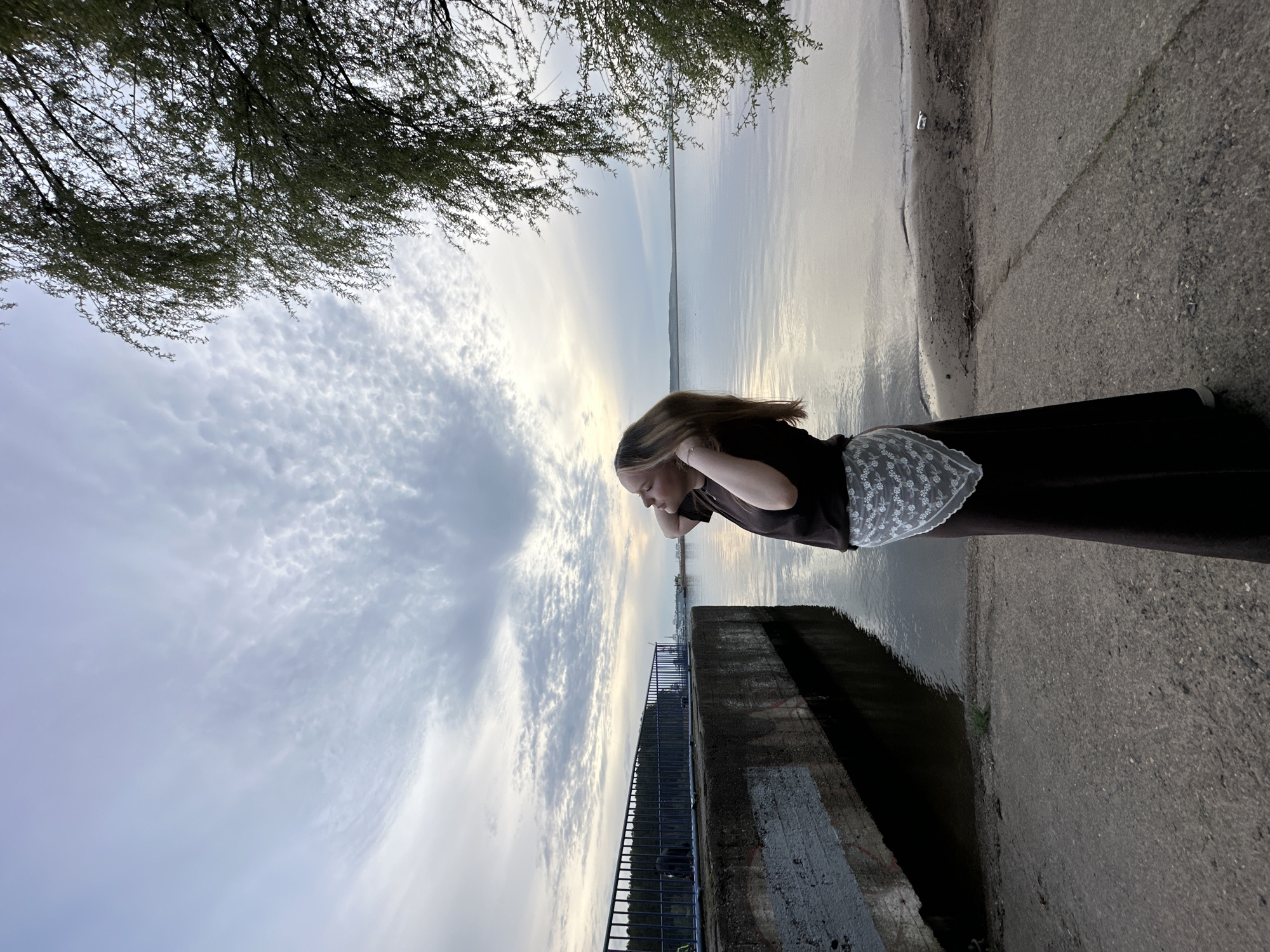 Woman photographed at Kama River waterfront in Chaikovsky, Russia