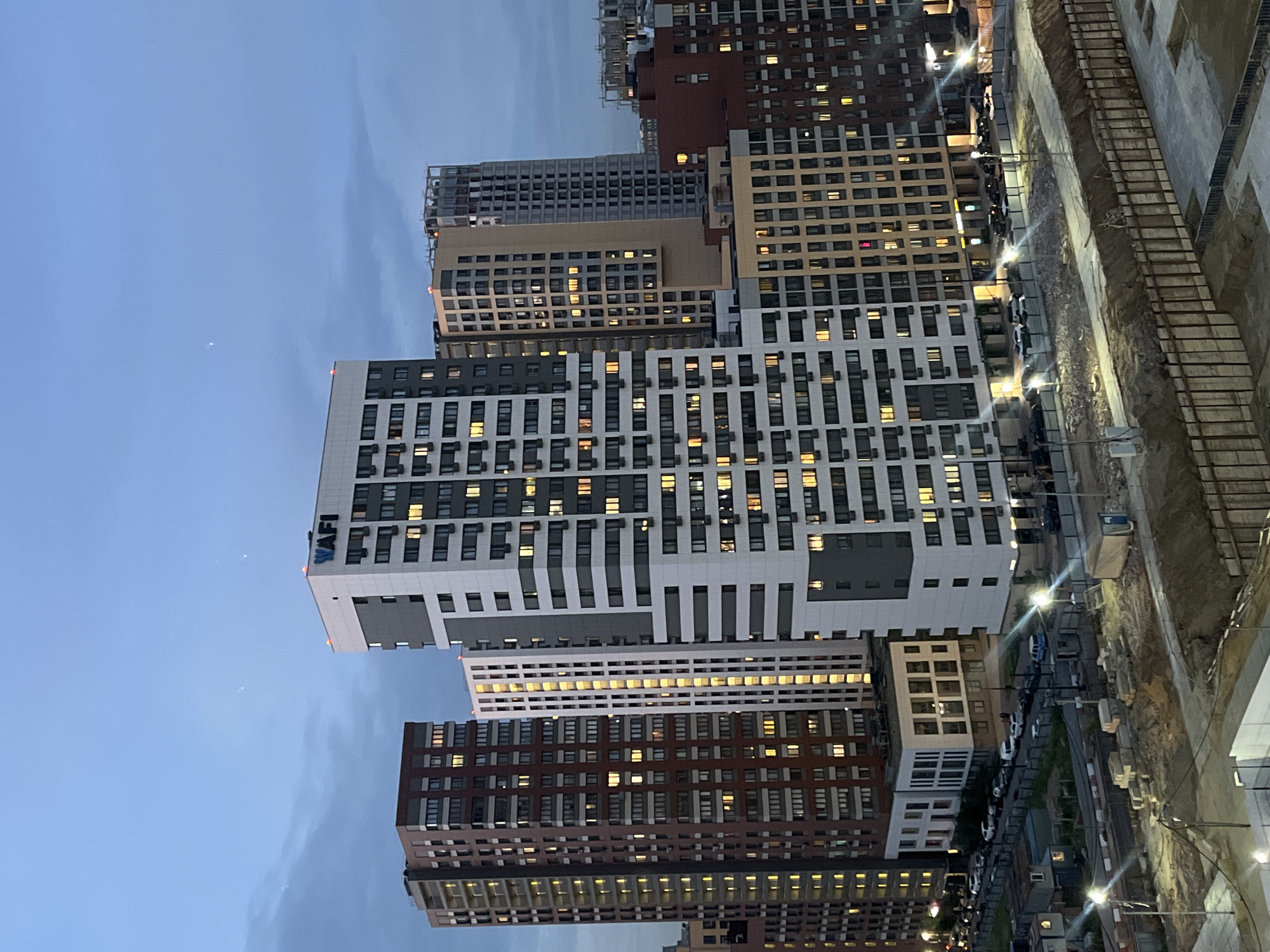 High-rise construction underway at dusk in Tarasovka, Russia