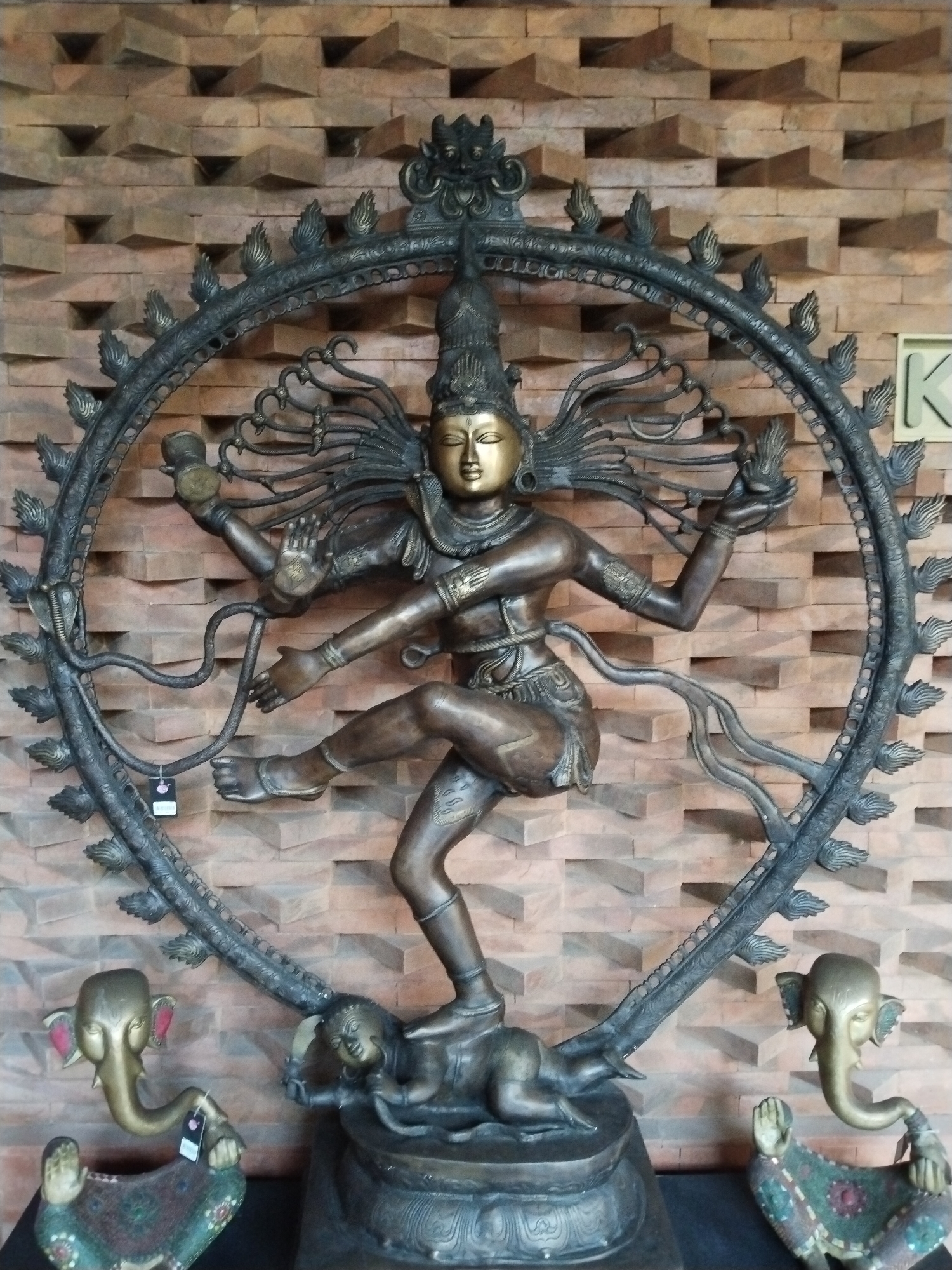 Balinese statues and a koi courtyard in Kuta
