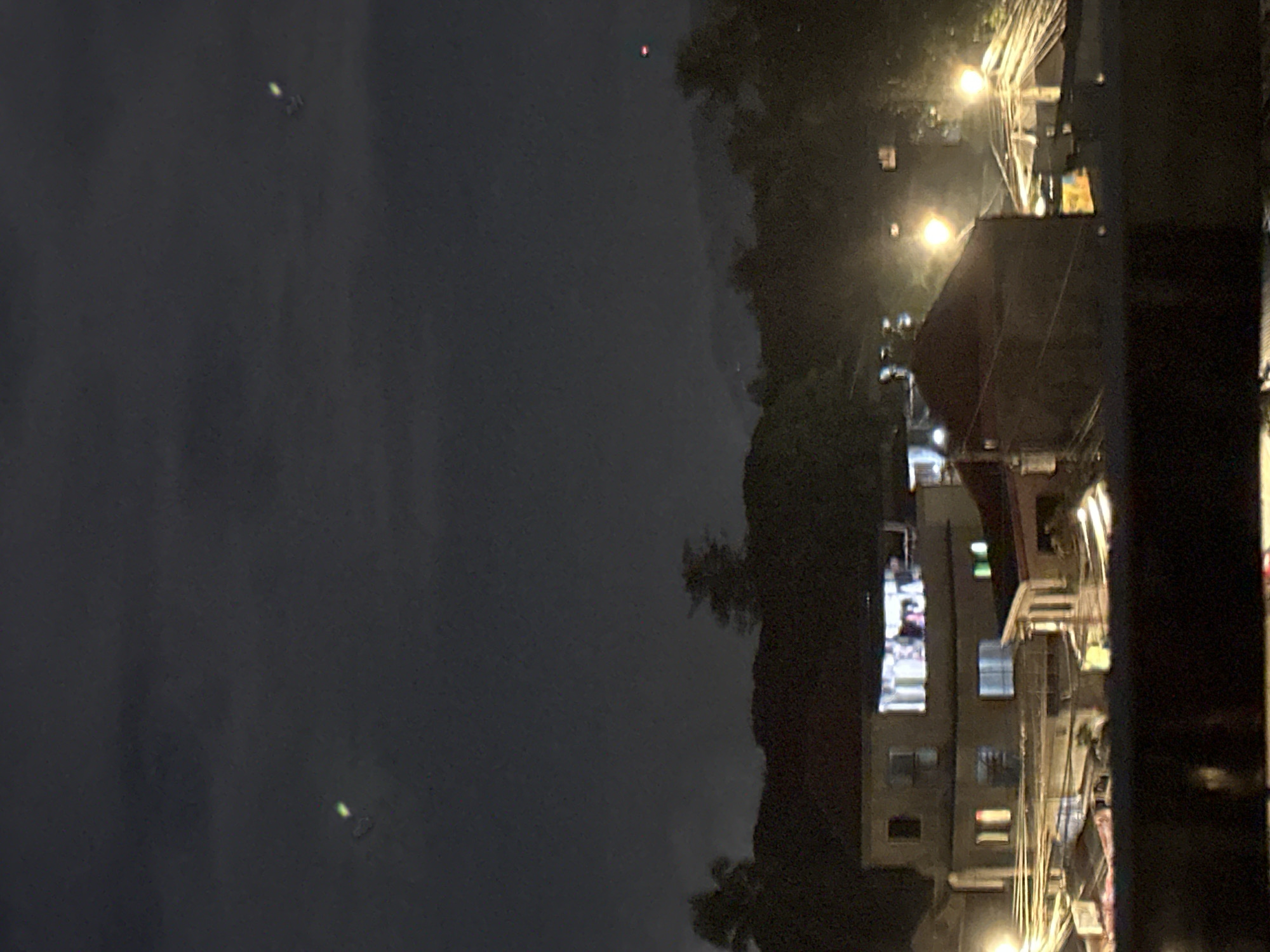 Moonlit night over Davao City's rooftops with a glowing skyline