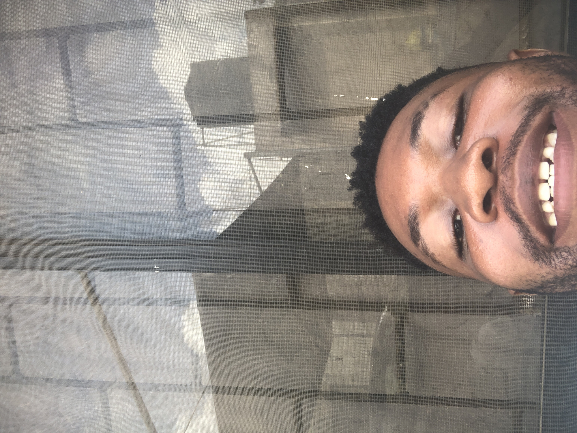 Man with laptop enjoys casual morning moments on steps