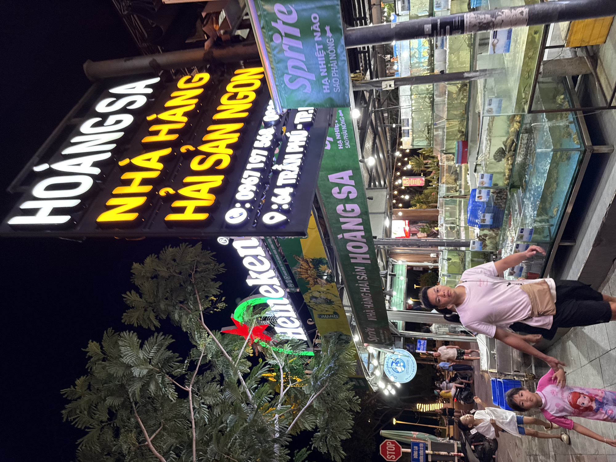 Nha Trang's lit-up restaurant and street stall strip at night