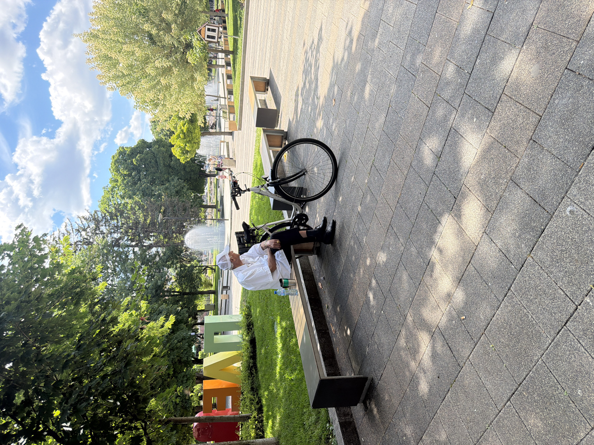 Afternoon in a Pleven park: bench, bike, and fountain