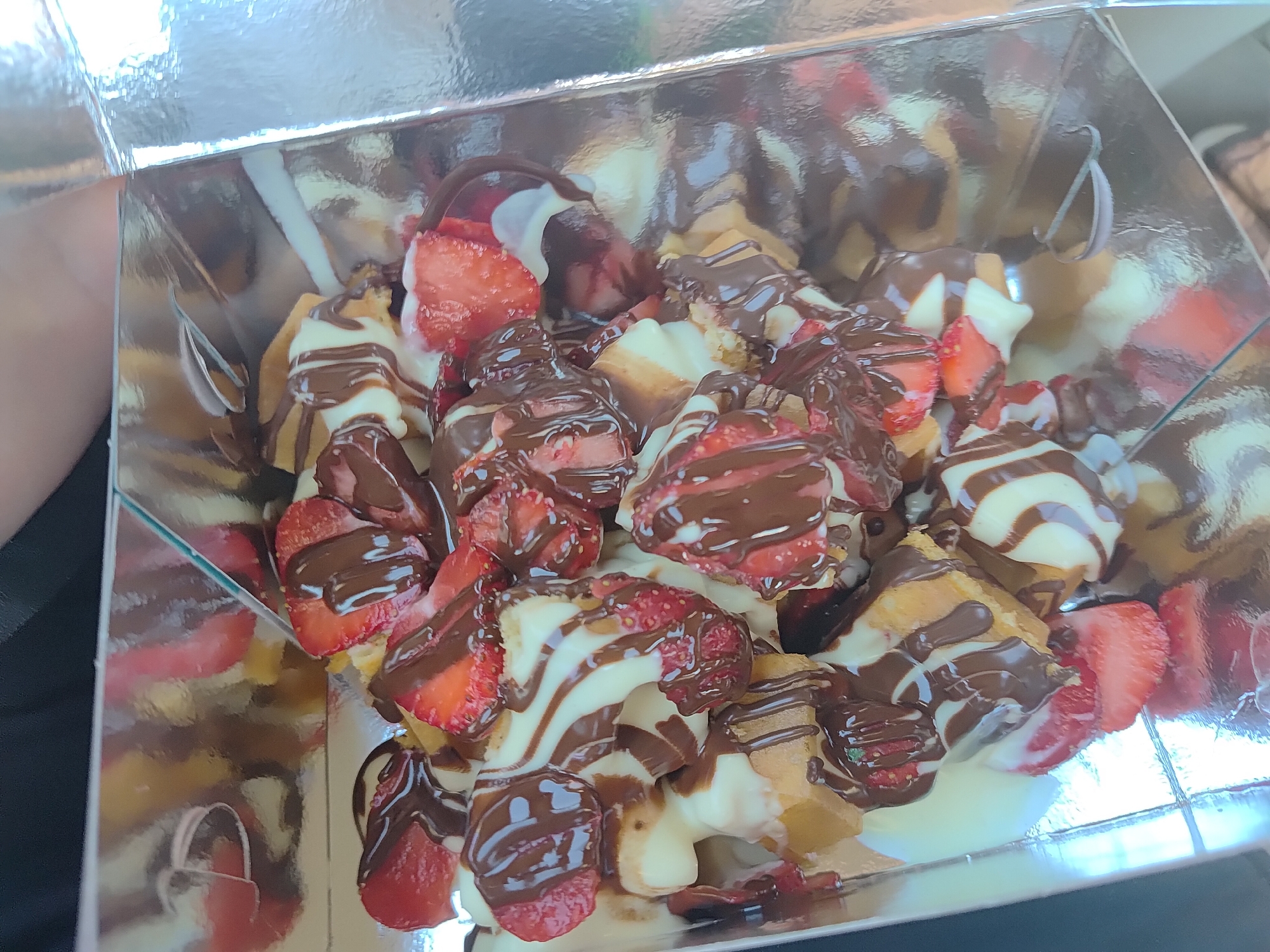 Waffles, strawberries, and roses in close-up detail shots