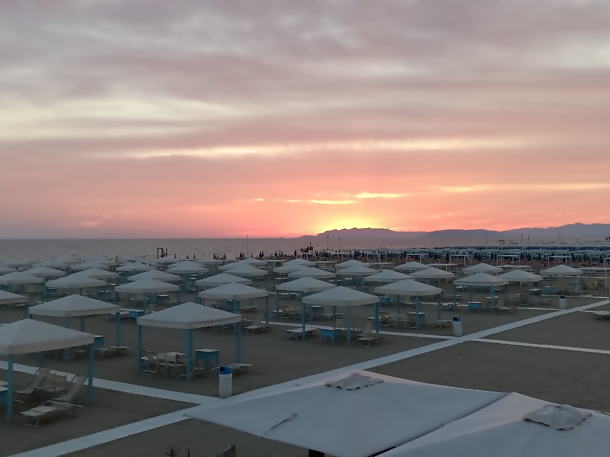 Viareggio beach resort at golden hour, two angles