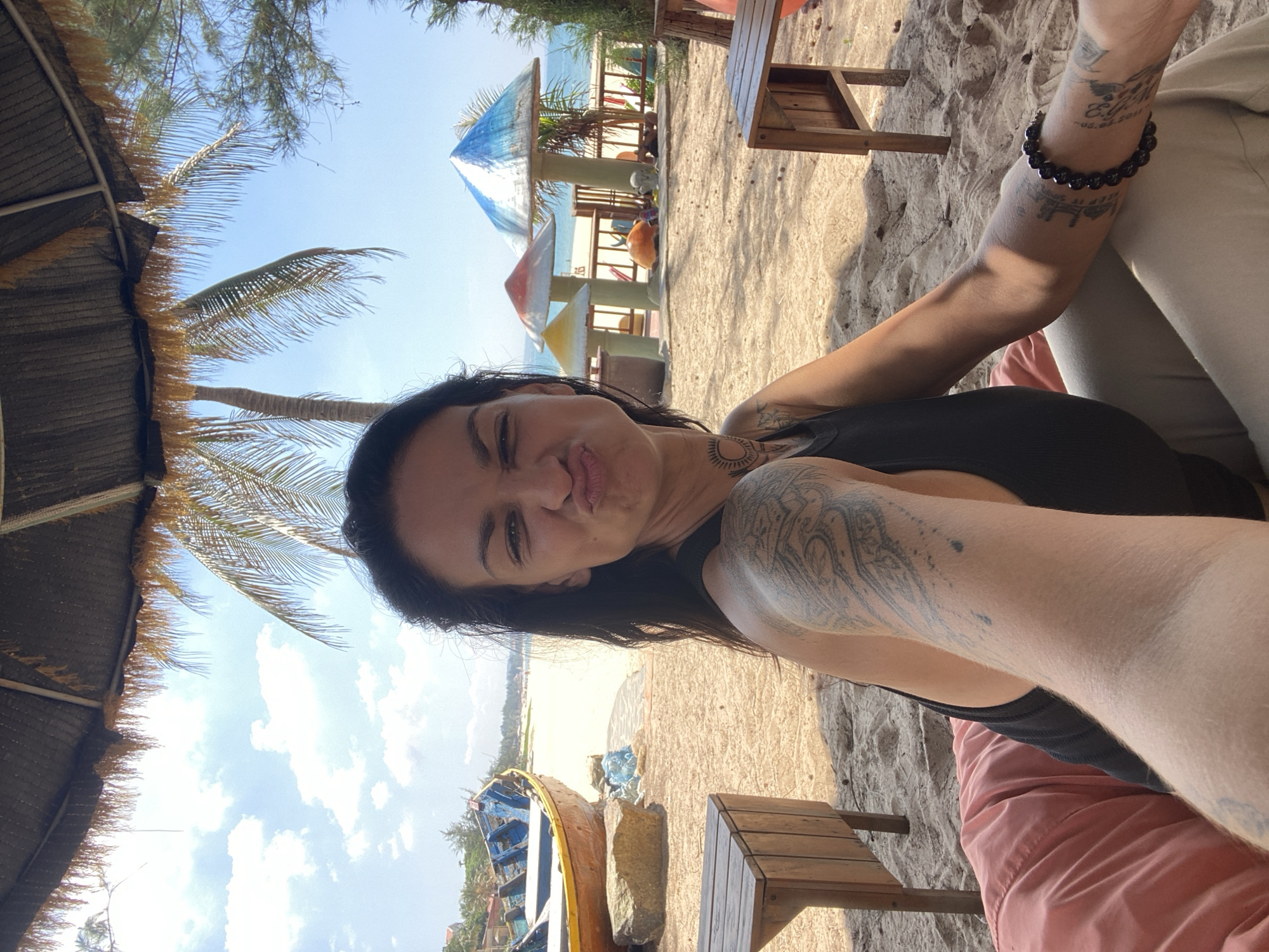 Woman takes beach selfies on beanbag in Vietnam