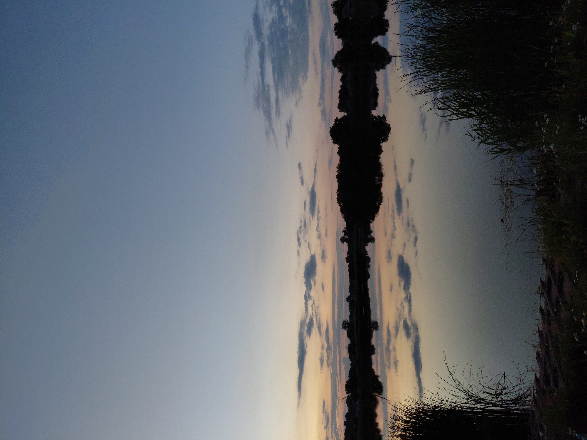 Sunset to dusk across the wetlands and village edges of Ustyvytsia