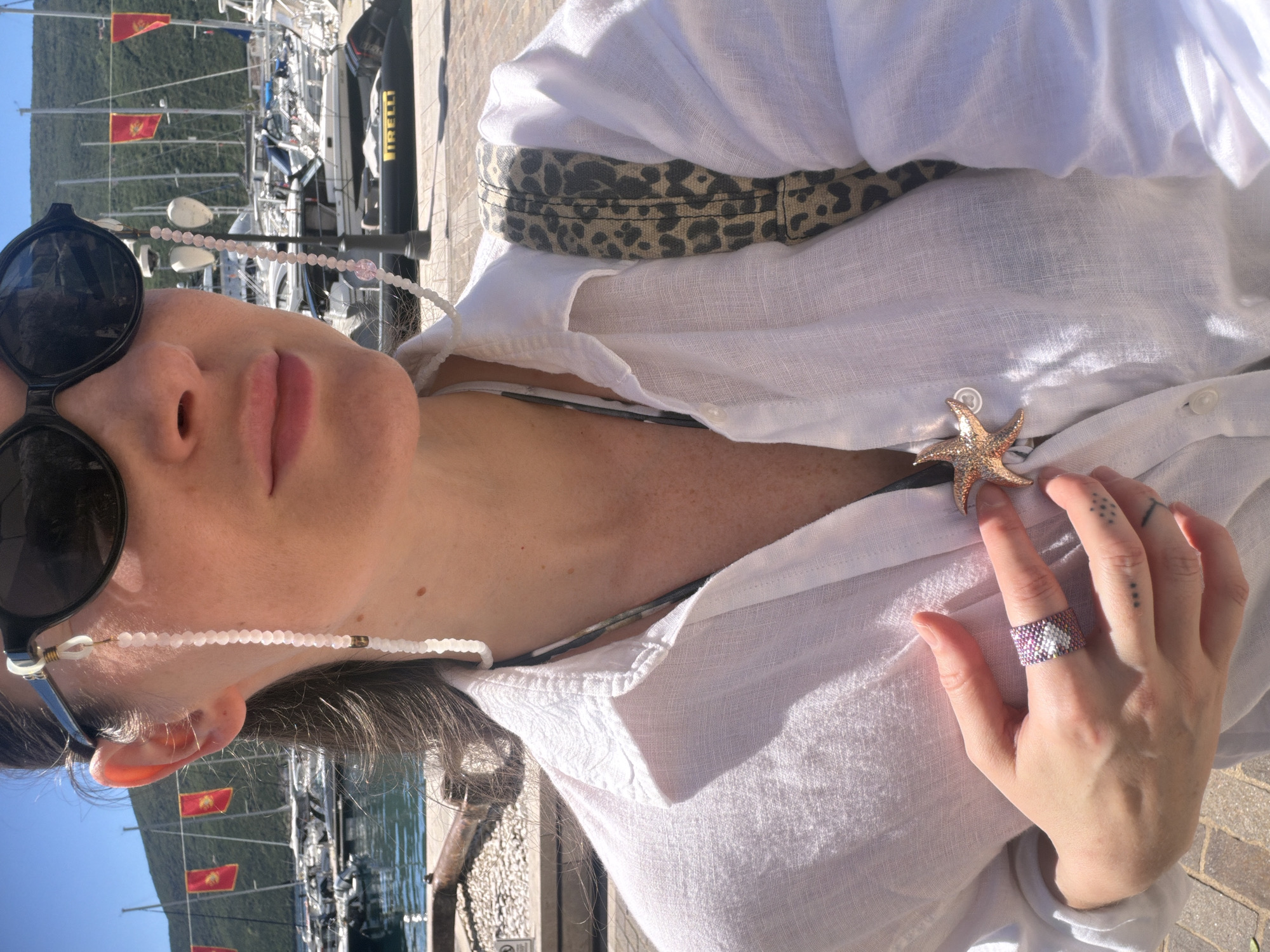 Woman in starfish-adorned shirt spotted at Montenegro marina