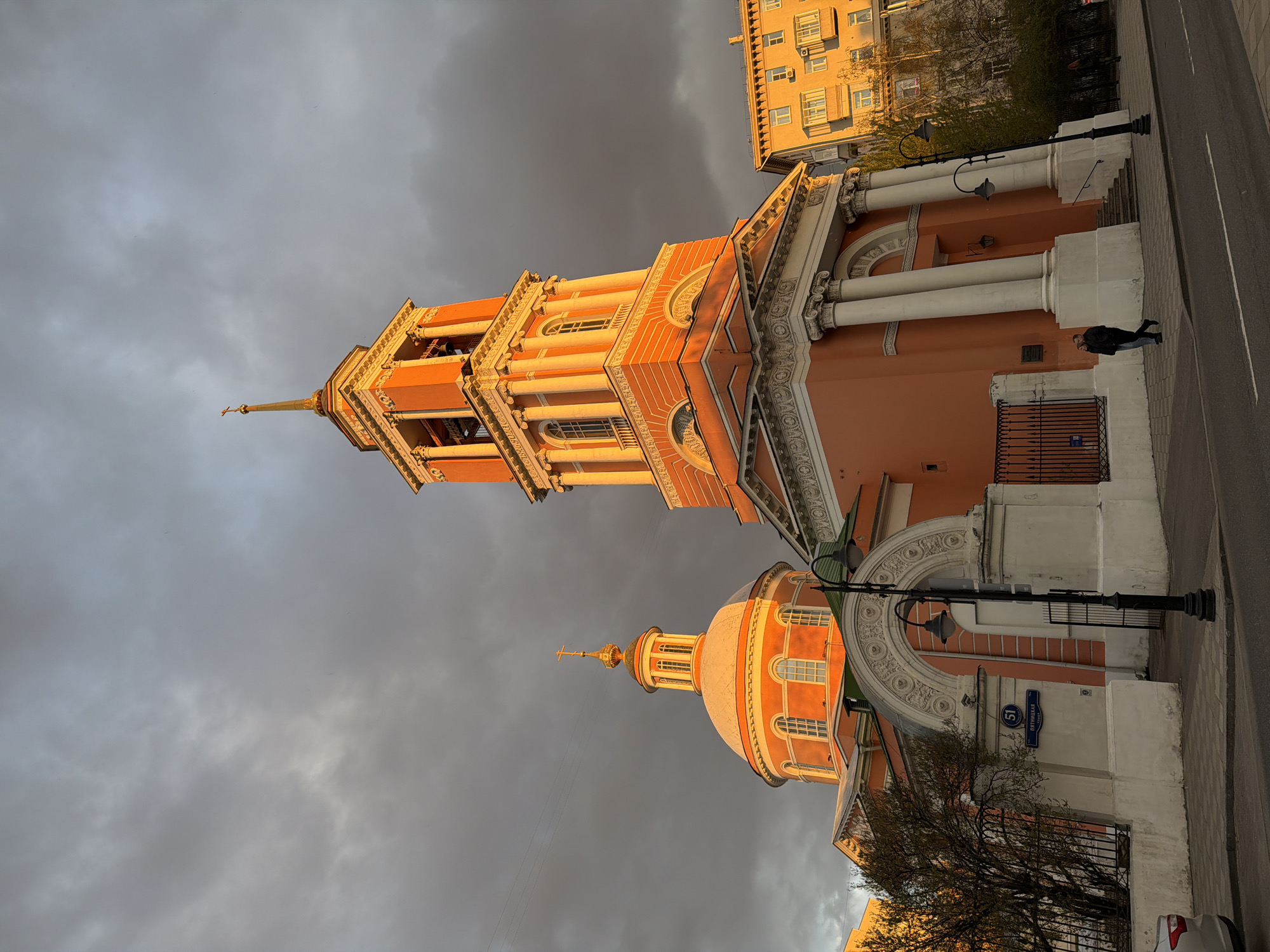 Moscow street scene captured during dramatic golden hour lighting