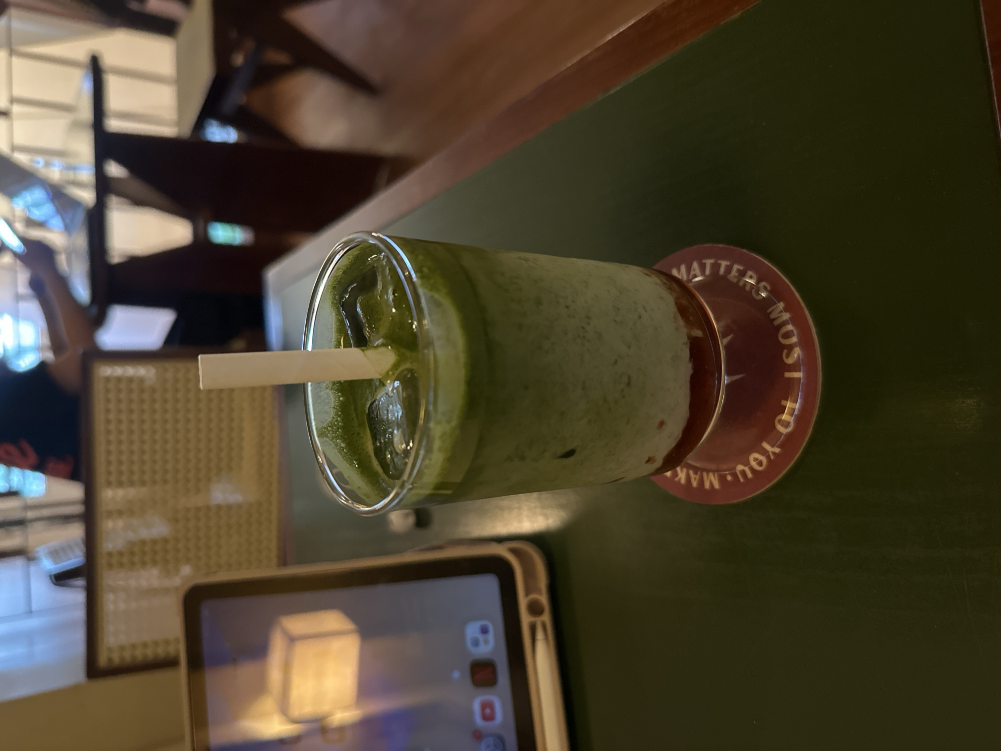 Matcha drink and devices captured at Thủ Đức cafe