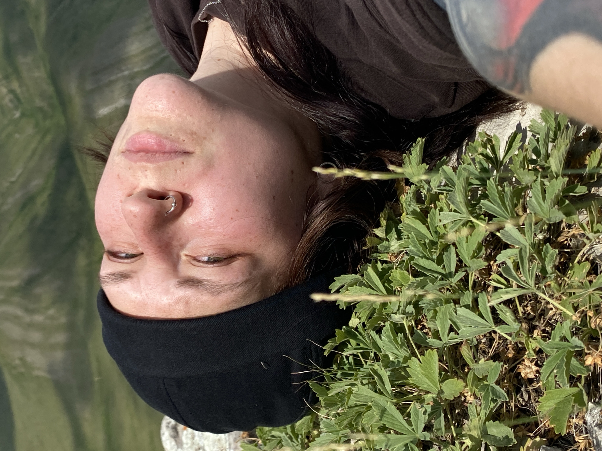 Woman documents solo hillside moment with selfies in Russia