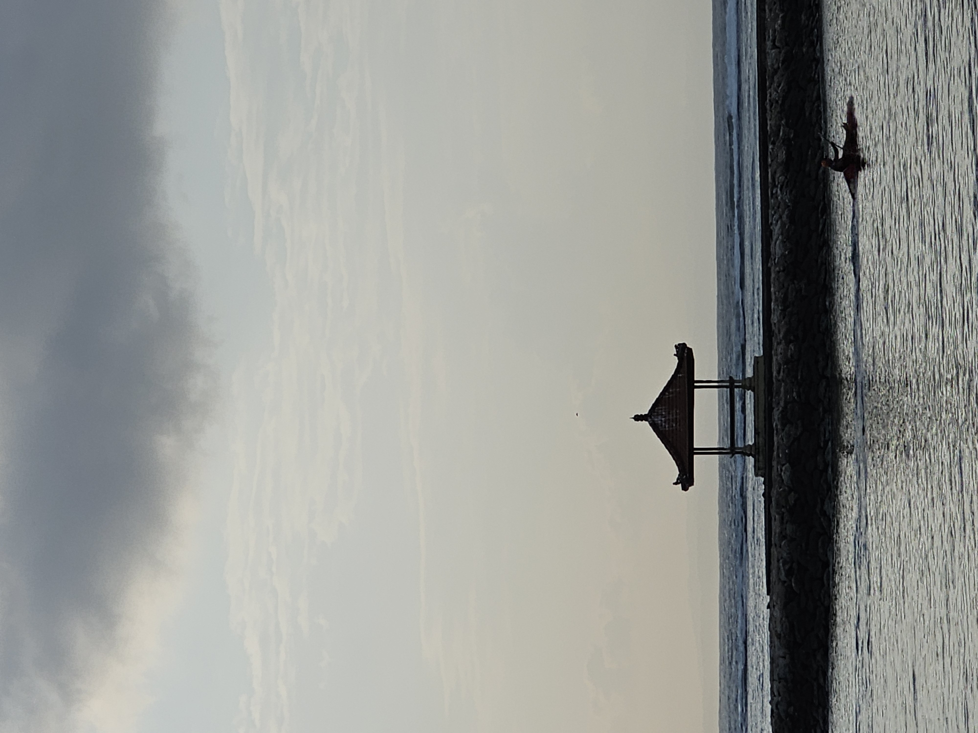 Overcast afternoon on Denpasar's coast, beach life in full swing