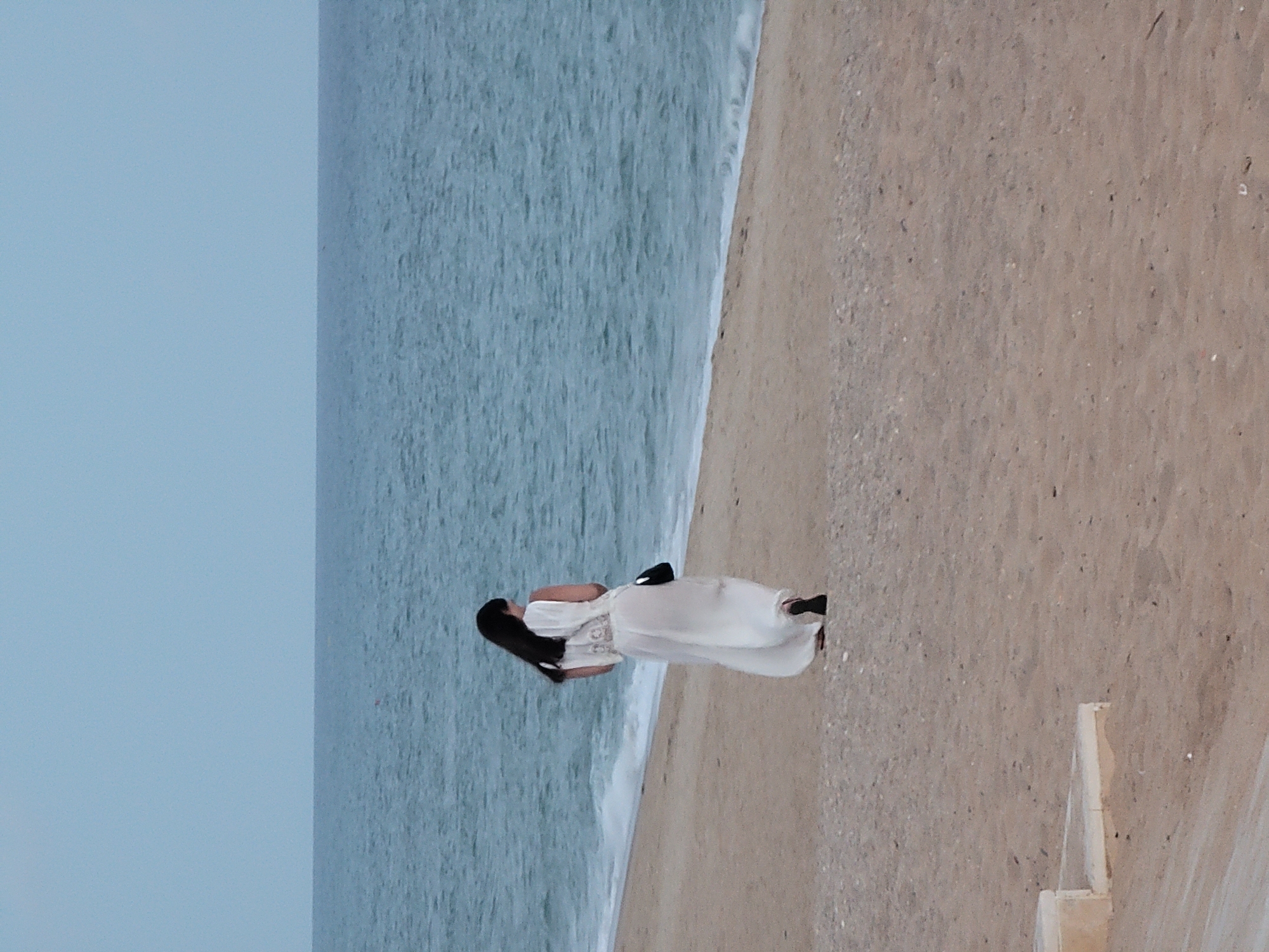Quarteira beachfront at dusk: promenade life, street performance, summer evening