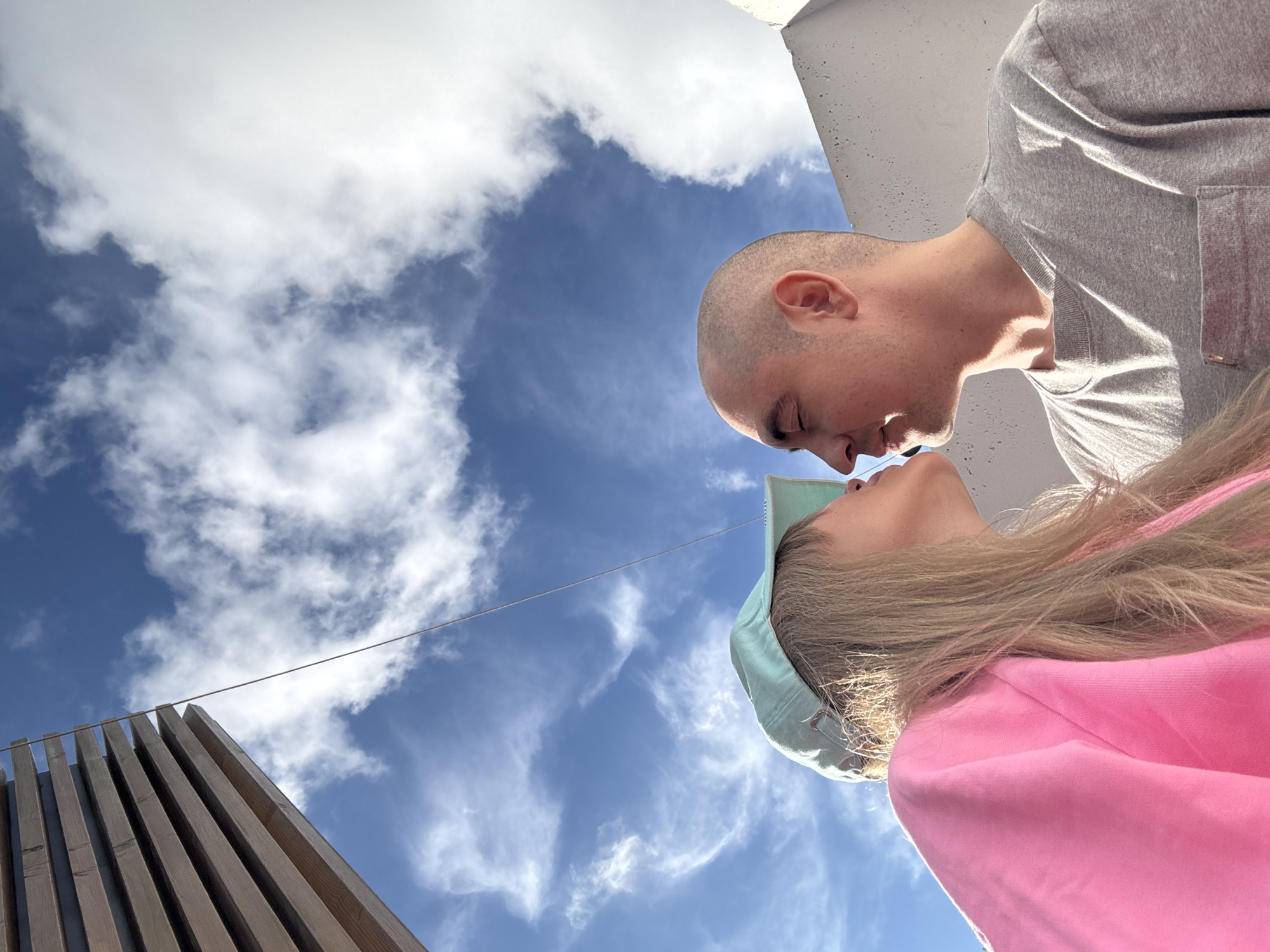Couple hang out near pink stairs in sunny Yekaterinburg