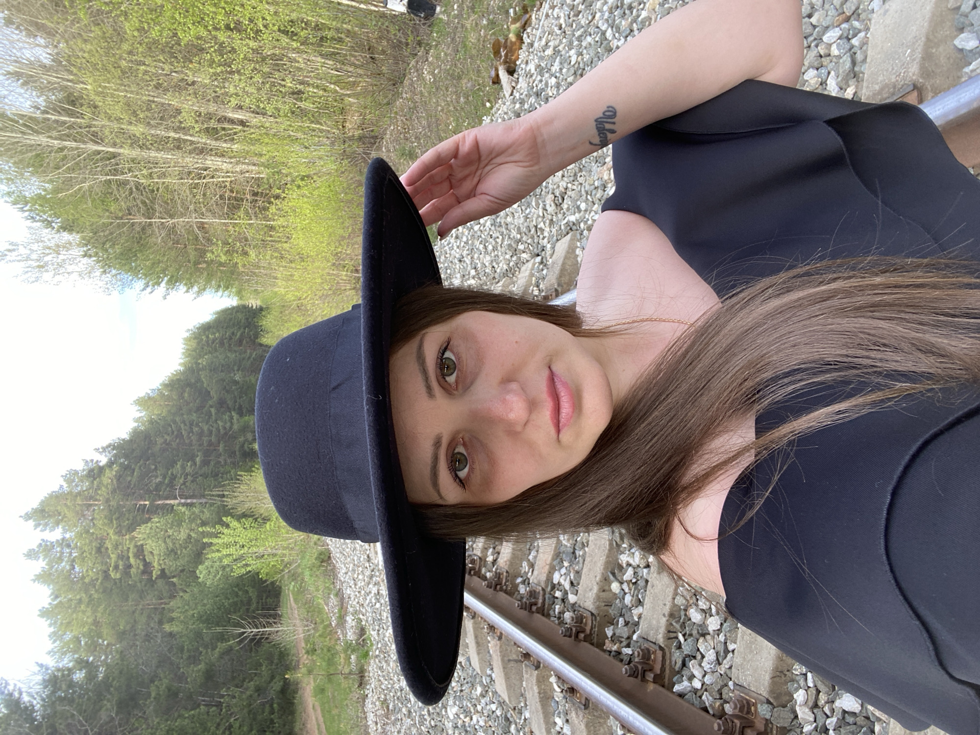 Woman poses on railway tracks in Chaikovsky, Russia